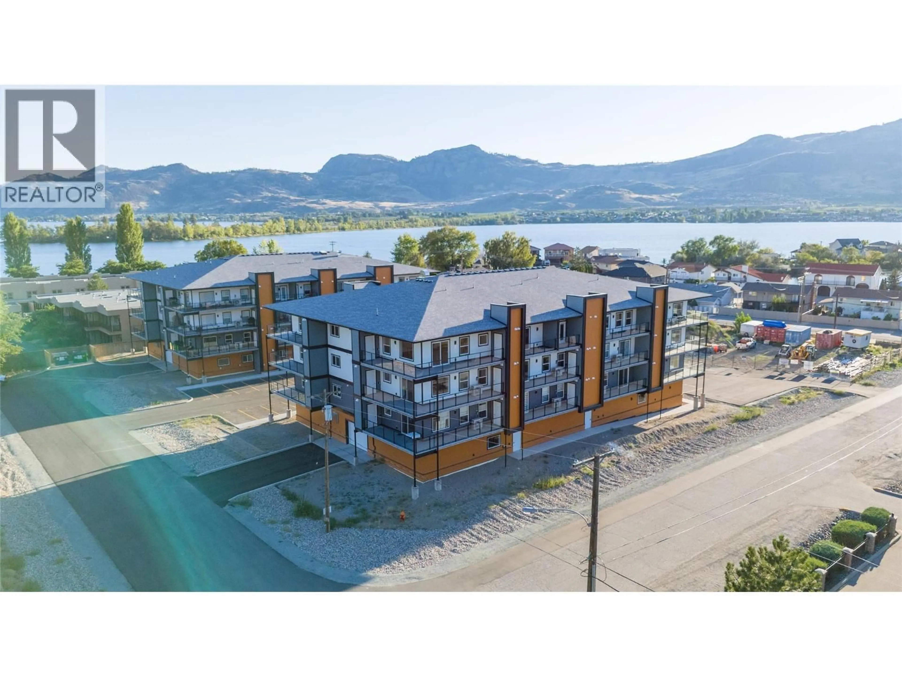 A pic from outside/outdoor area/front of a property/back of a property/a pic from drone, water/lake/river/ocean view for 407 - 5640 51ST STREET, Osoyoos British Columbia V0H1V6