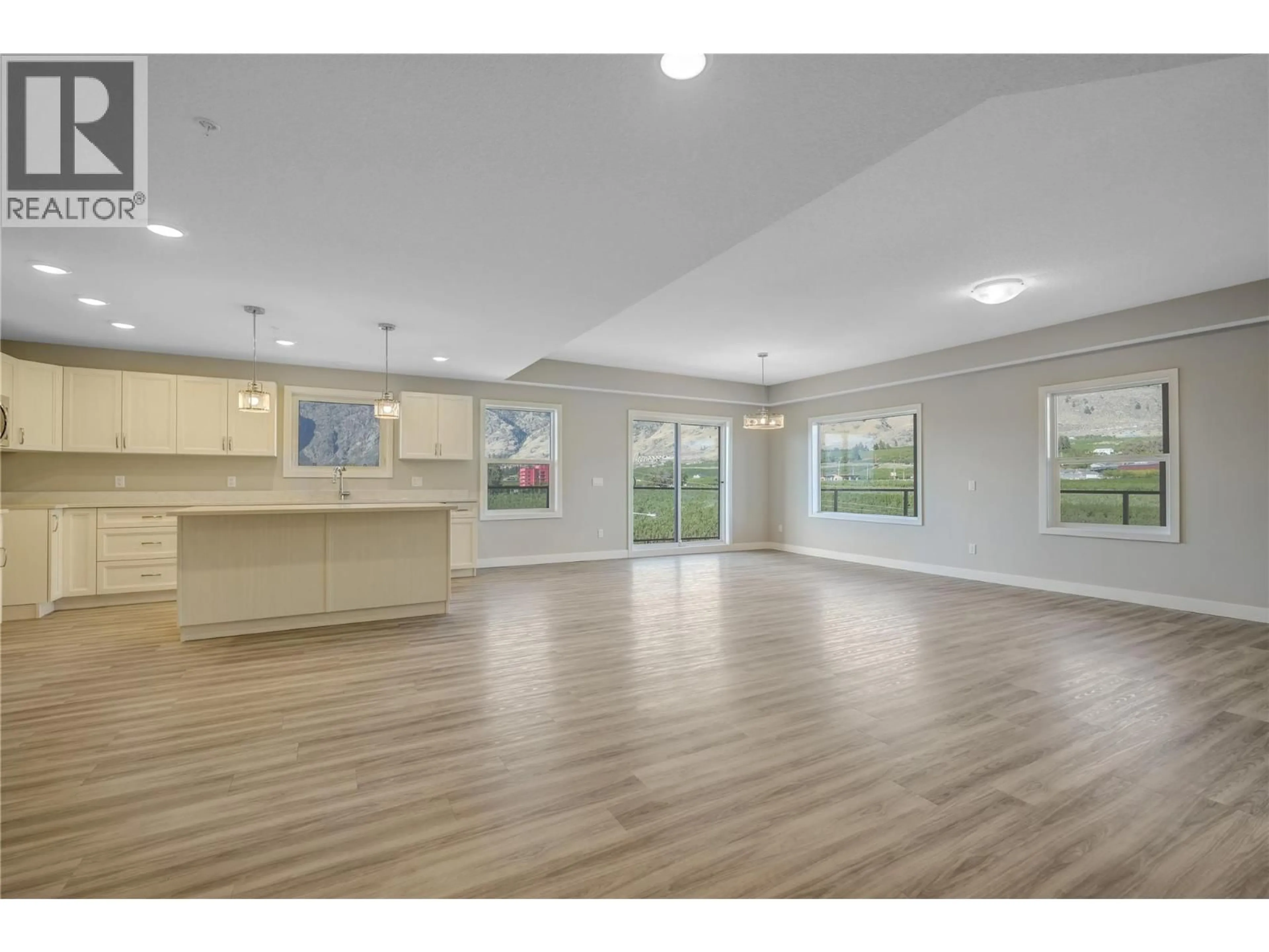 Open concept kitchen, wood/laminate floor for 407 - 5640 51ST STREET, Osoyoos British Columbia V0H1V6