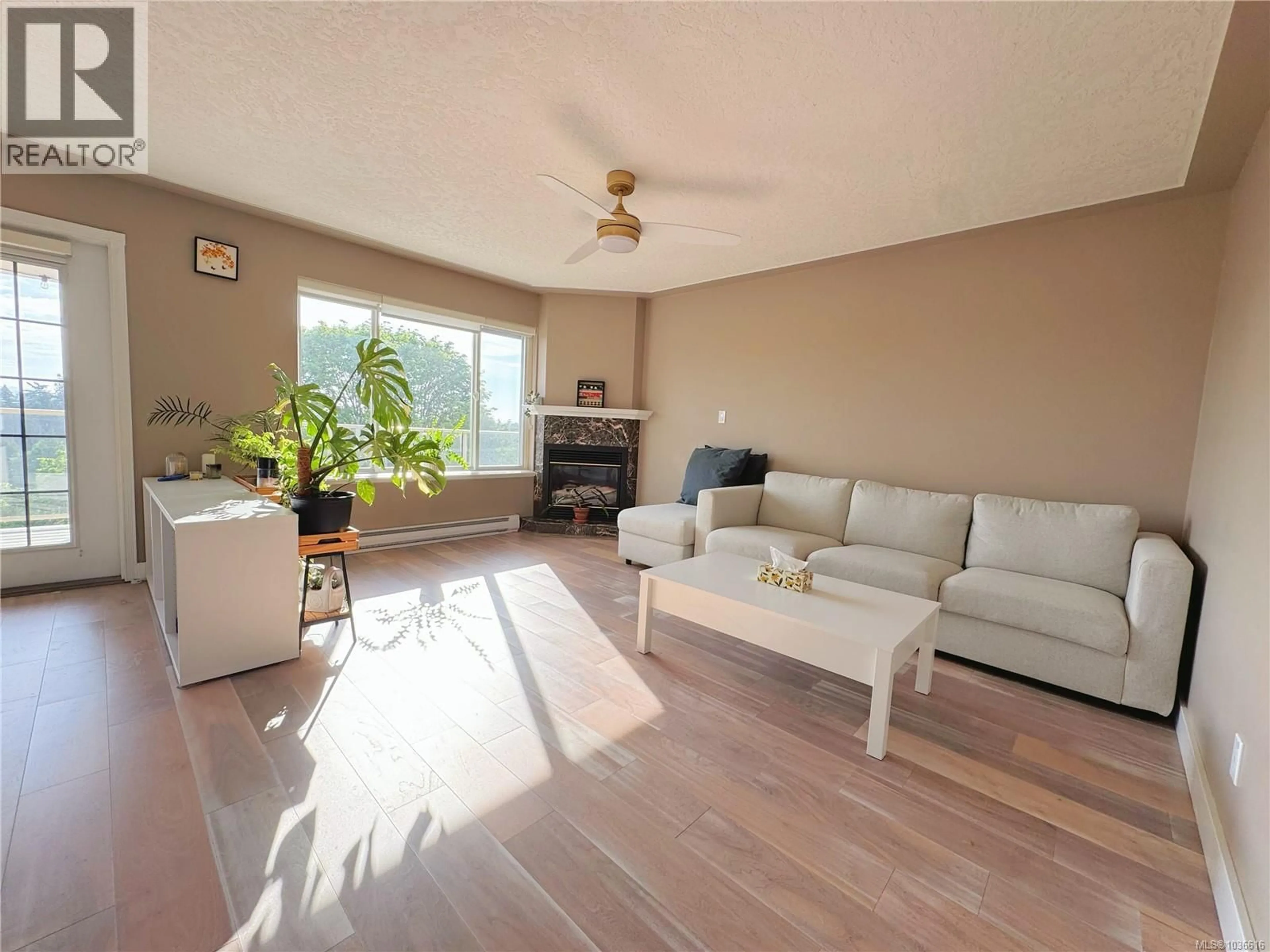 Living room with furniture, wood/laminate floor for 2596 CRYSTALVIEW DRIVE, Langford British Columbia V9B6M9