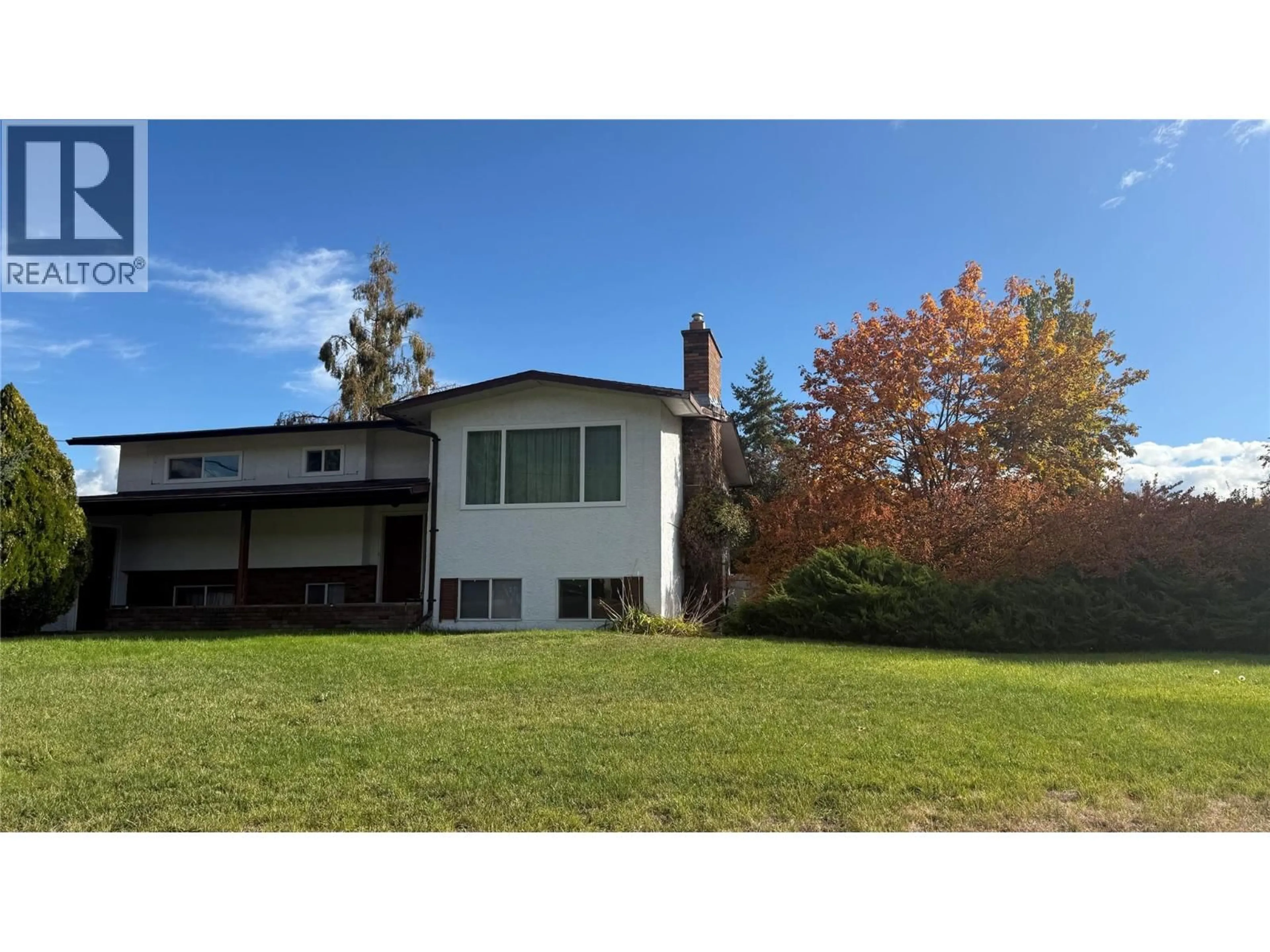 A pic from outside/outdoor area/front of a property/back of a property/a pic from drone, unknown for 169 CARIBOO ROAD, Kelowna British Columbia V1V2E4