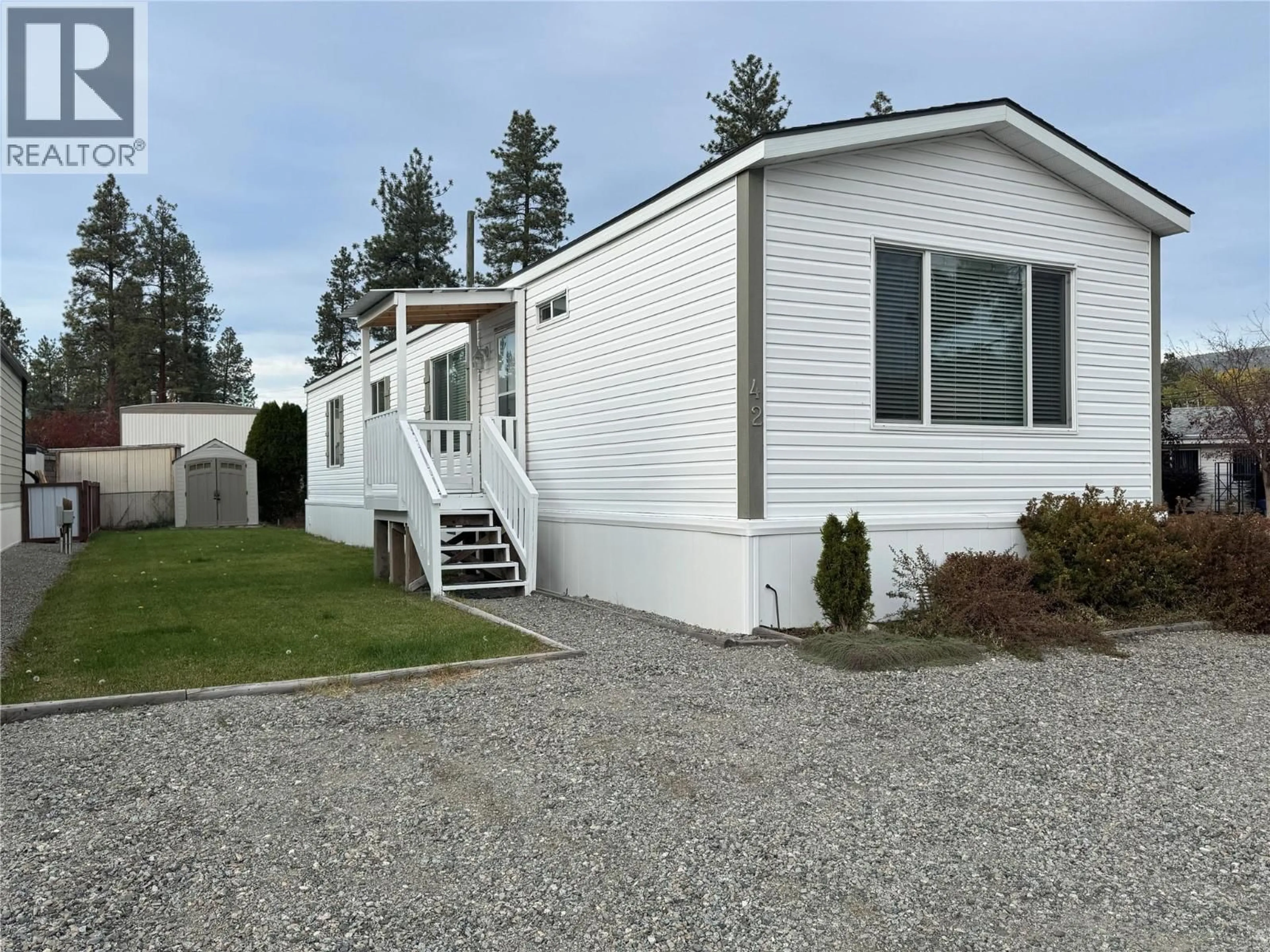 Home with vinyl exterior material, street for 42 - 254 8 HIGHWAY, Merritt British Columbia V1K1M7