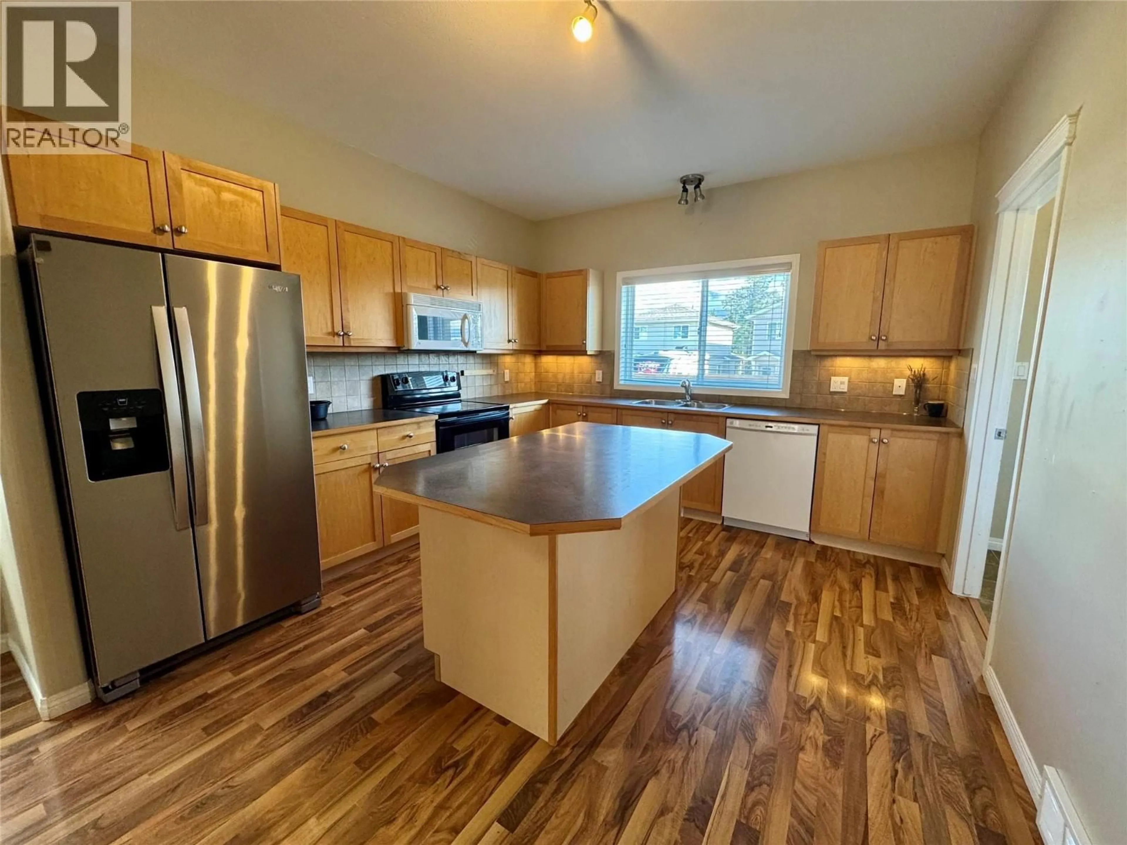 Open concept kitchen, wood/laminate floor for 2205 WESTSIDE PARK AVENUE, Invermere British Columbia V0A1K4