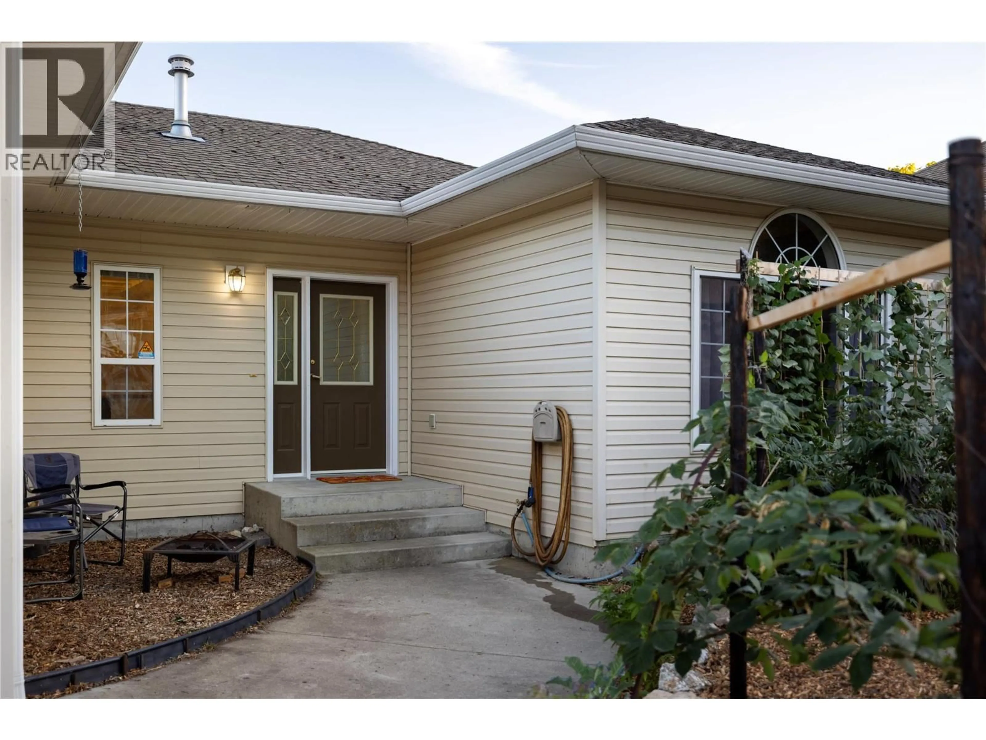 Home with vinyl exterior material, street for 5808 HERITAGE DRIVE, Vernon British Columbia V1H1A5