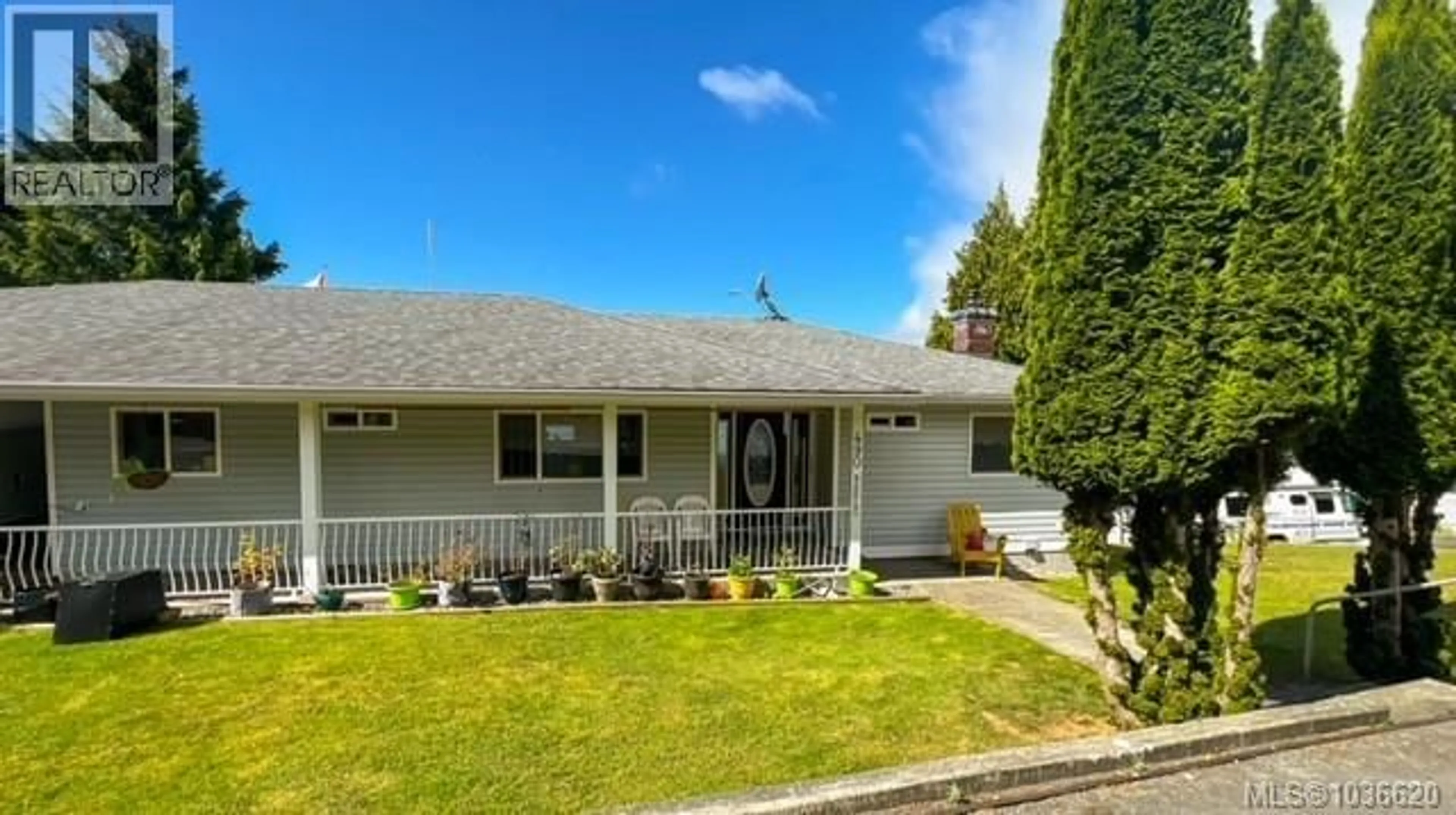 Home with vinyl exterior material, street for 490 2ND STREET, Sointula British Columbia V0N3E0