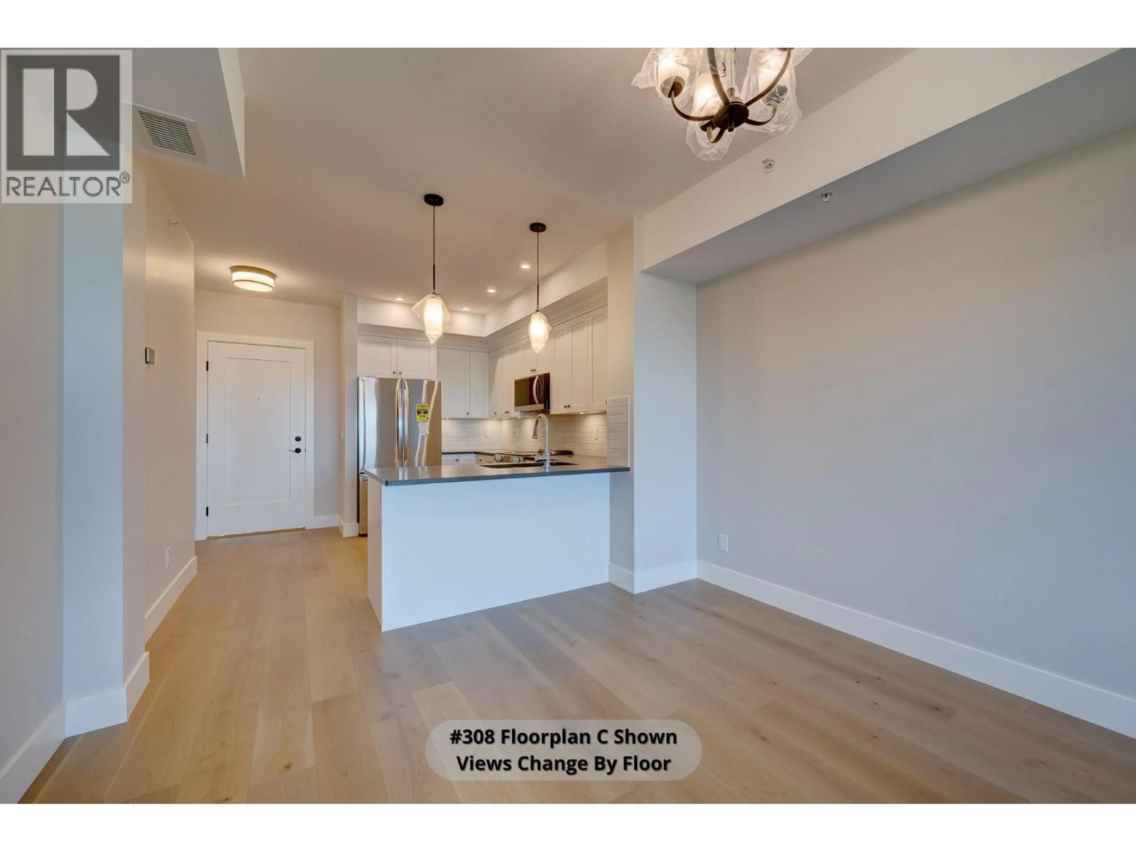 Open concept kitchen, wood/laminate floor for 301 - 2171 VAN HORNE DRIVE, Kamloops British Columbia V1S0E2