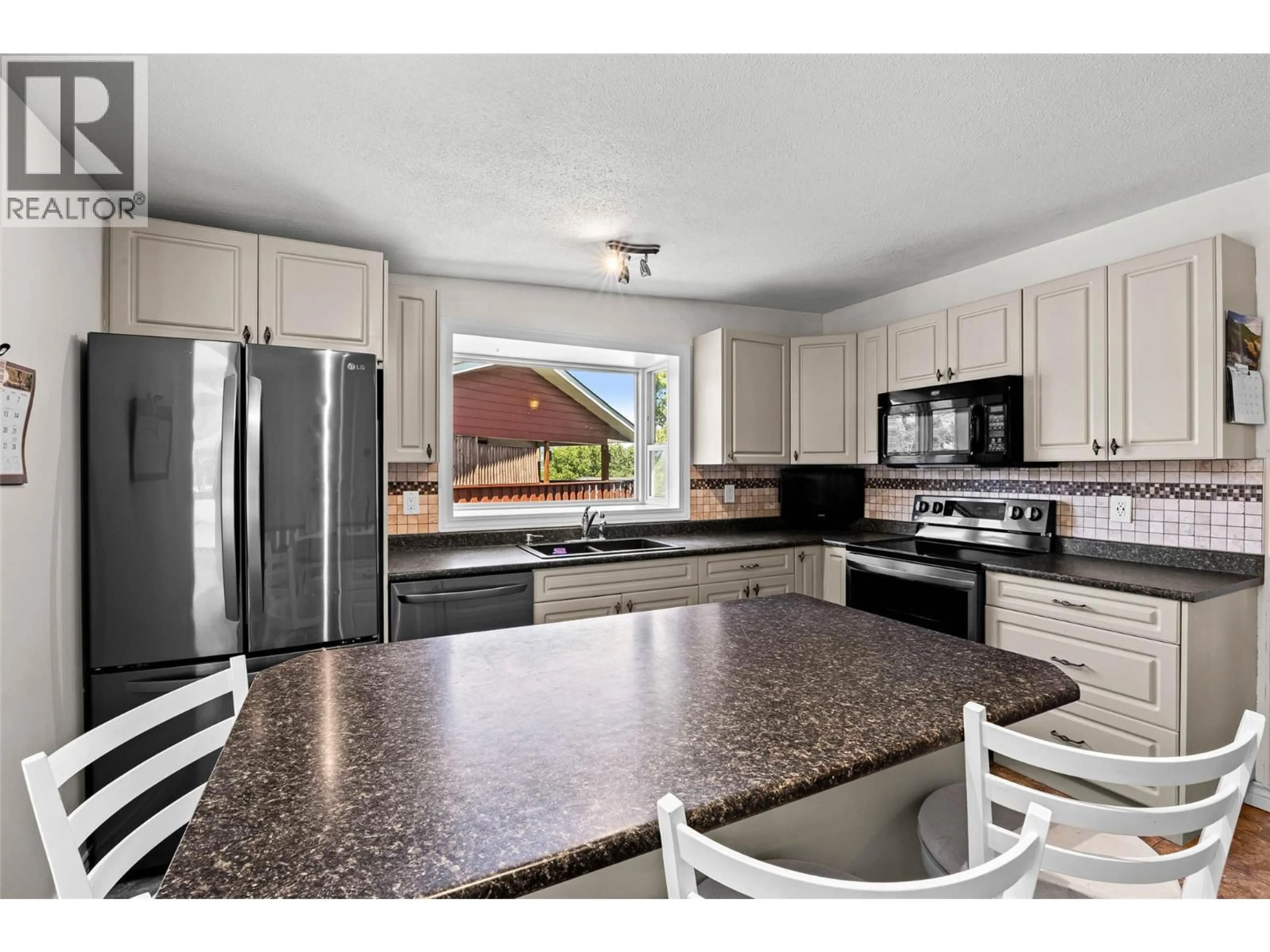 Open concept kitchen, ceramic/tile floor for 135 WHITESHIELD CRESCENT, Kamloops British Columbia V2E1H2