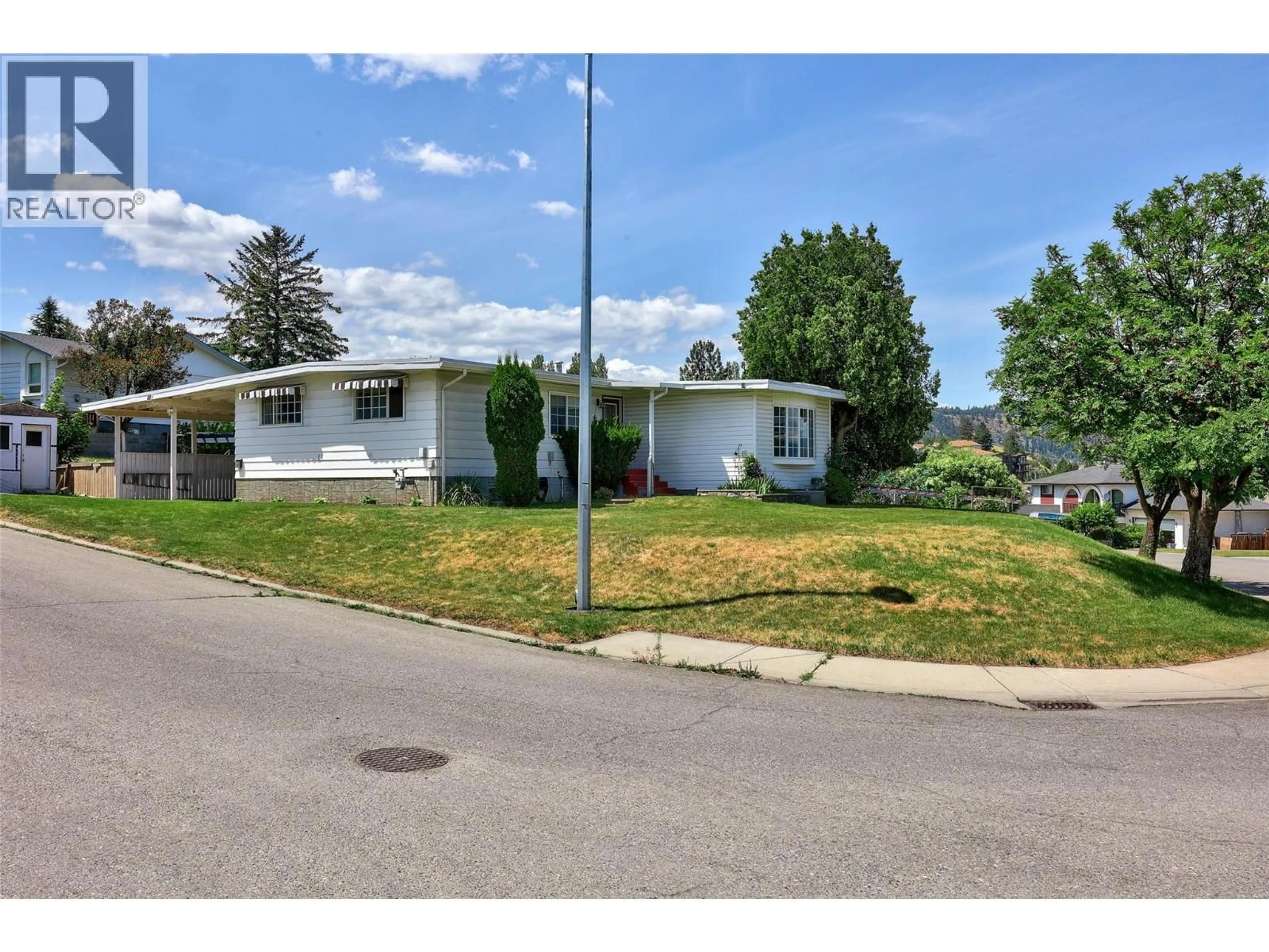 Home with vinyl exterior material, street for 135 WHITESHIELD CRESCENT, Kamloops British Columbia V2E1H2