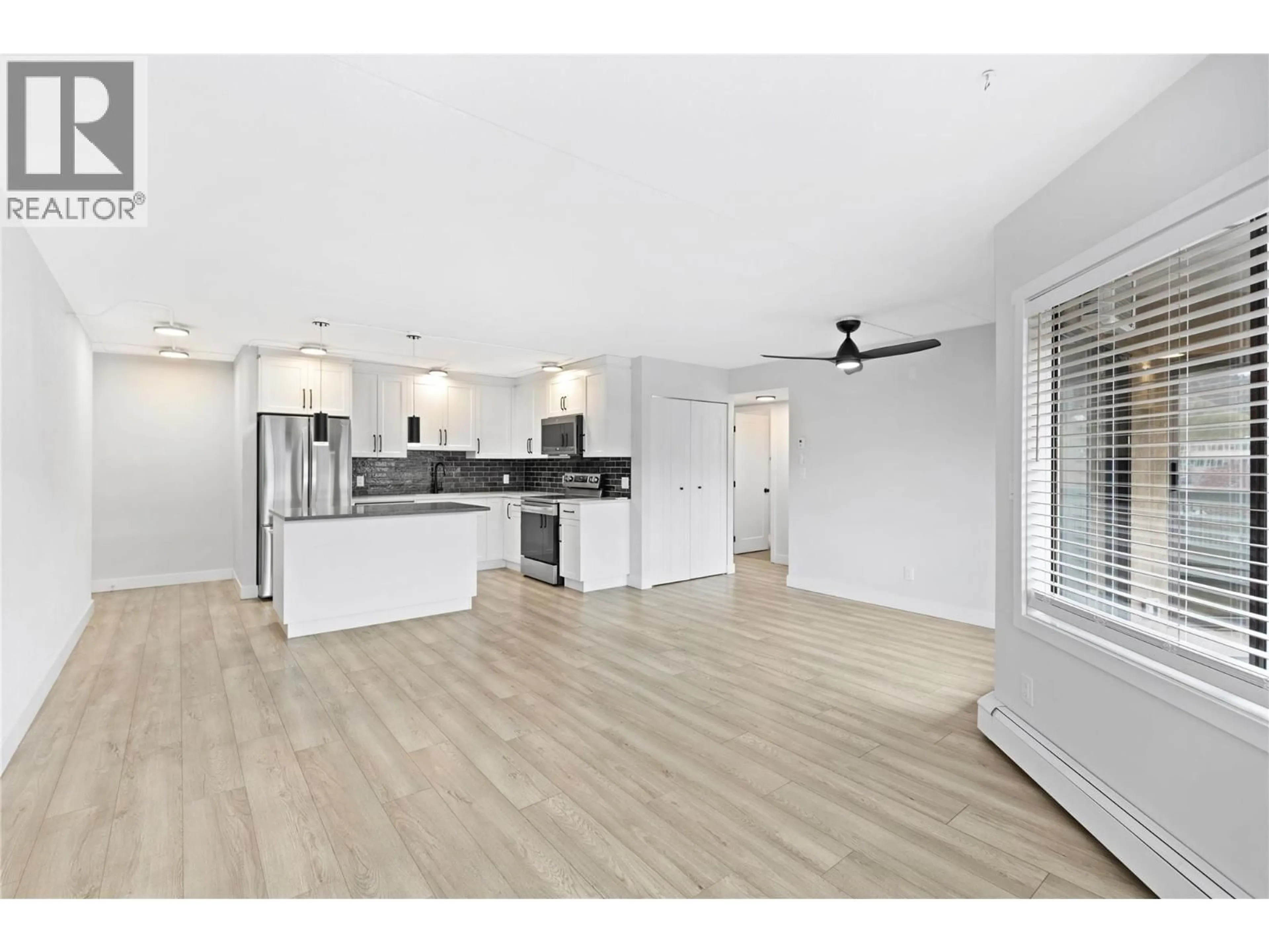 Open concept kitchen, wood/laminate floor for 403 - 525 NICOLA STREET, Kamloops British Columbia V2C6J5