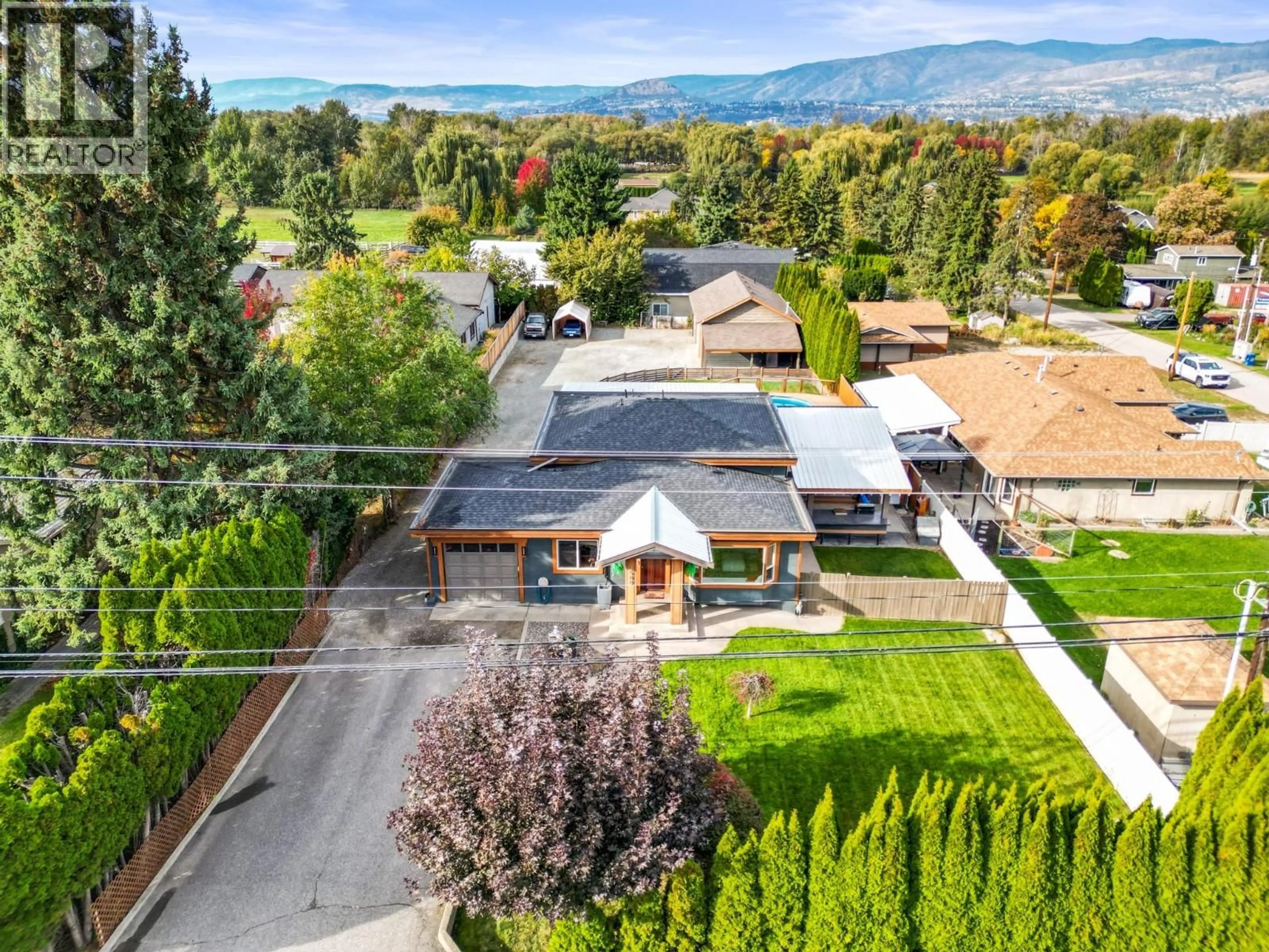 A pic from outside/outdoor area/front of a property/back of a property/a pic from drone, mountain view for 3588 SPIERS ROAD, Kelowna British Columbia V1W4A8