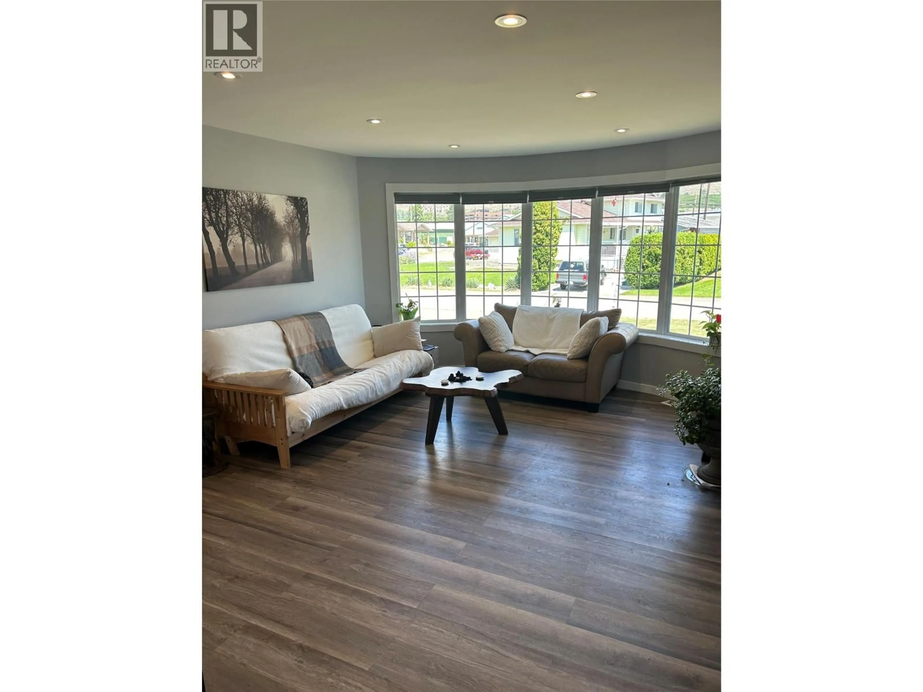 Living room with furniture, wood/laminate floor for 38 BAYVIEW CRESCENT, Osoyoos British Columbia V0H1V6
