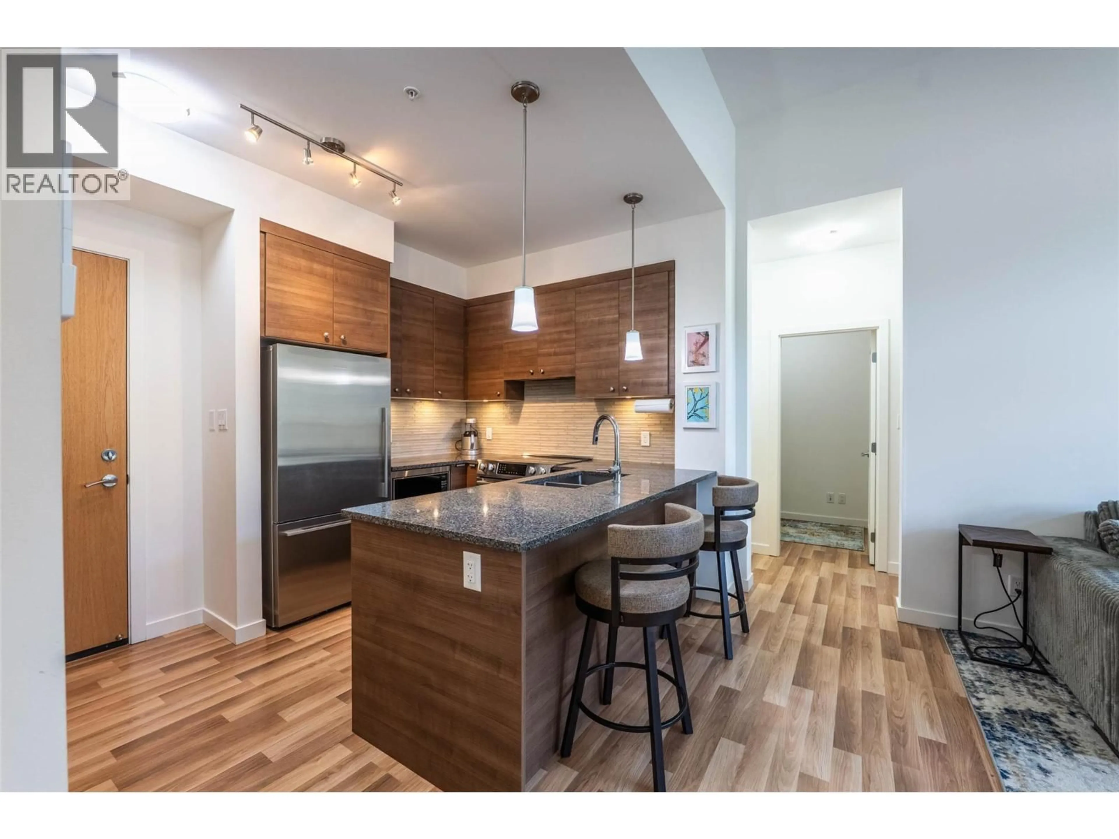 Open concept kitchen, wood/laminate floor for 407 - 710 VERNON STREET, Nelson British Columbia V1L4G2
