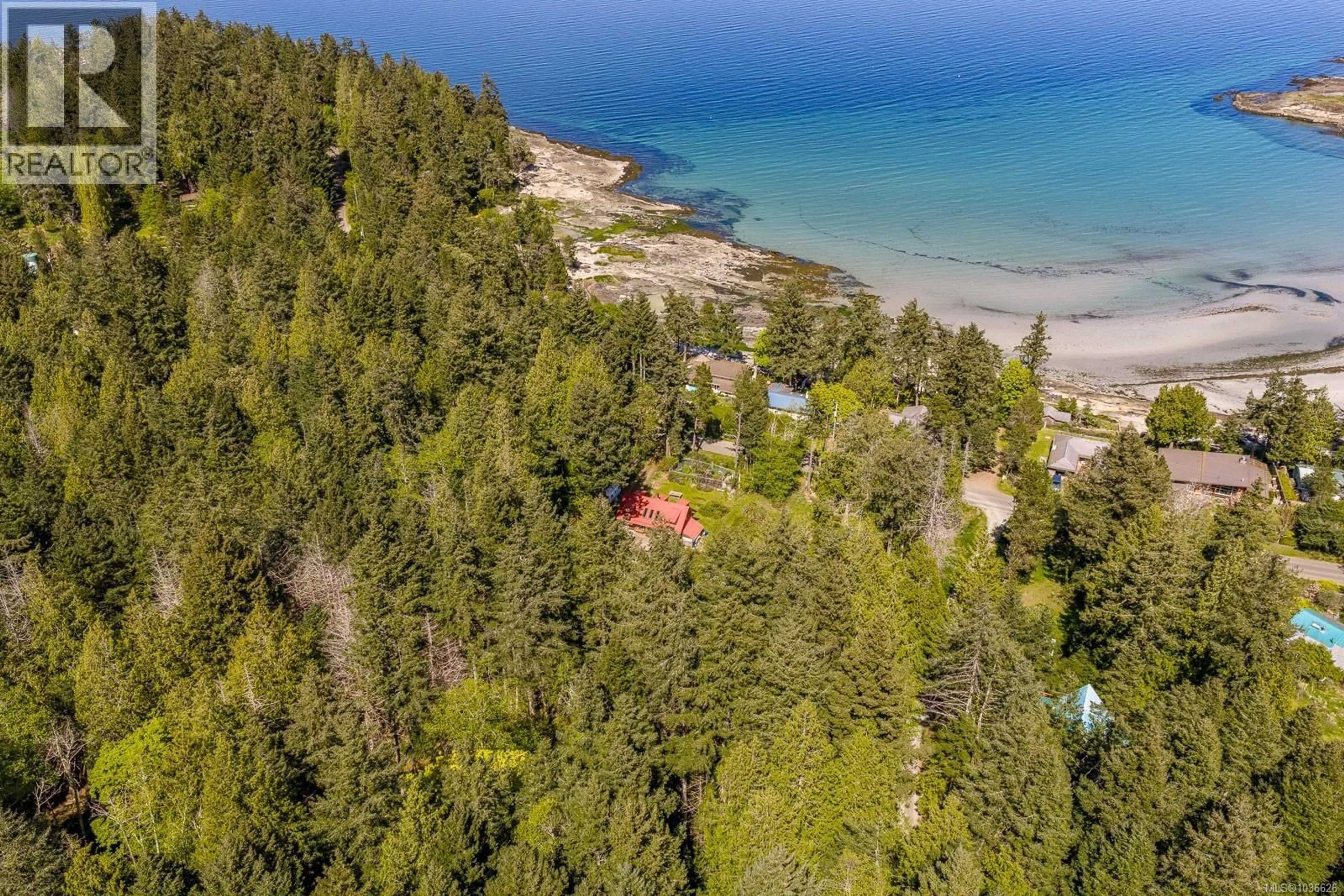A pic from outside/outdoor area/front of a property/back of a property/a pic from drone, water/lake/river/ocean view for 7670/7690 ANDERSON DRIVE, Hornby Island British Columbia V0R1Z0