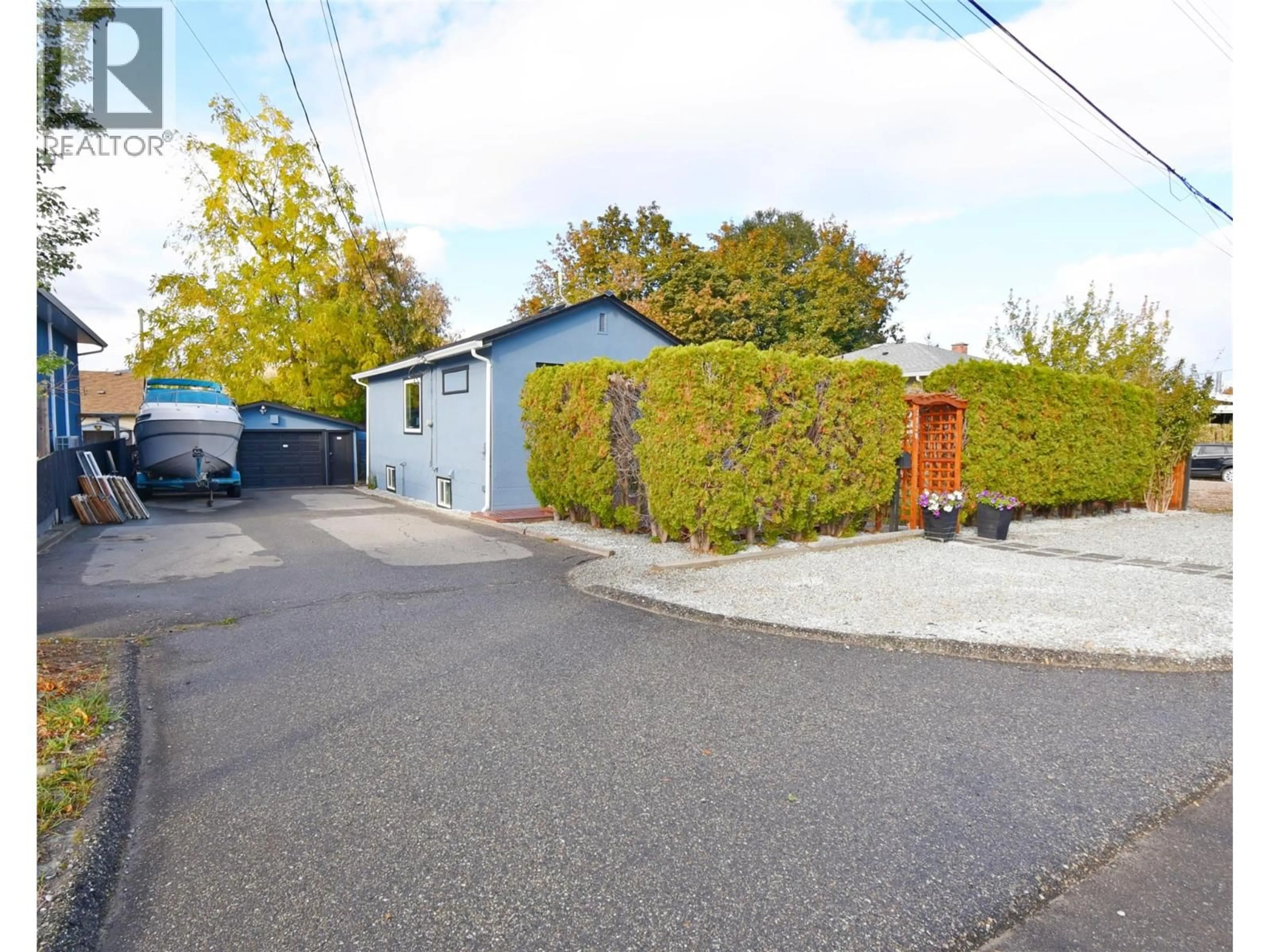 A pic from outside/outdoor area/front of a property/back of a property/a pic from drone, street for 3930 26 STREET, Vernon British Columbia V1T4V4