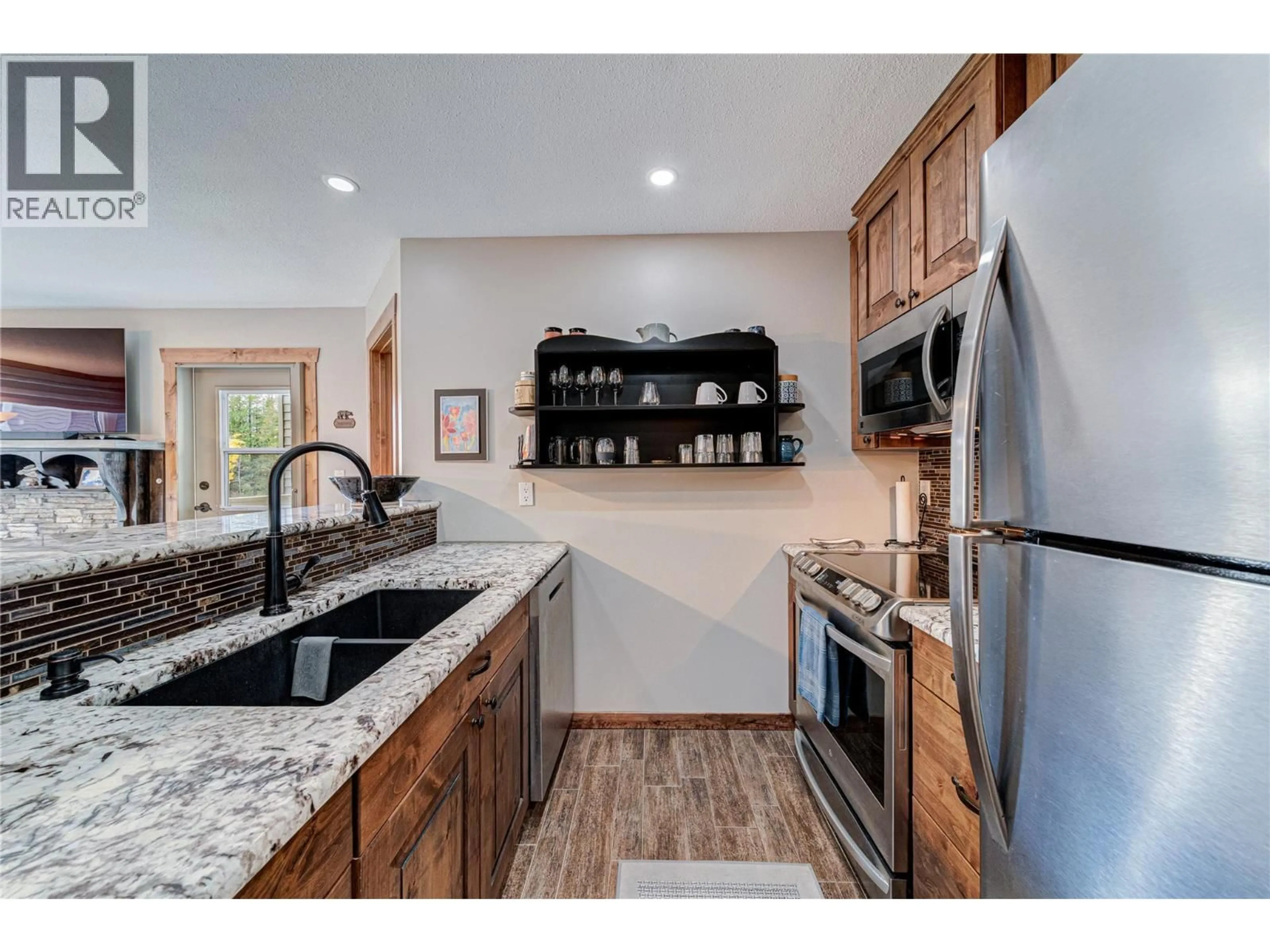 Open concept kitchen, ceramic/tile floor for 221-4559 TIMBERLINE CRESCENT, Fernie British Columbia V0B1M6