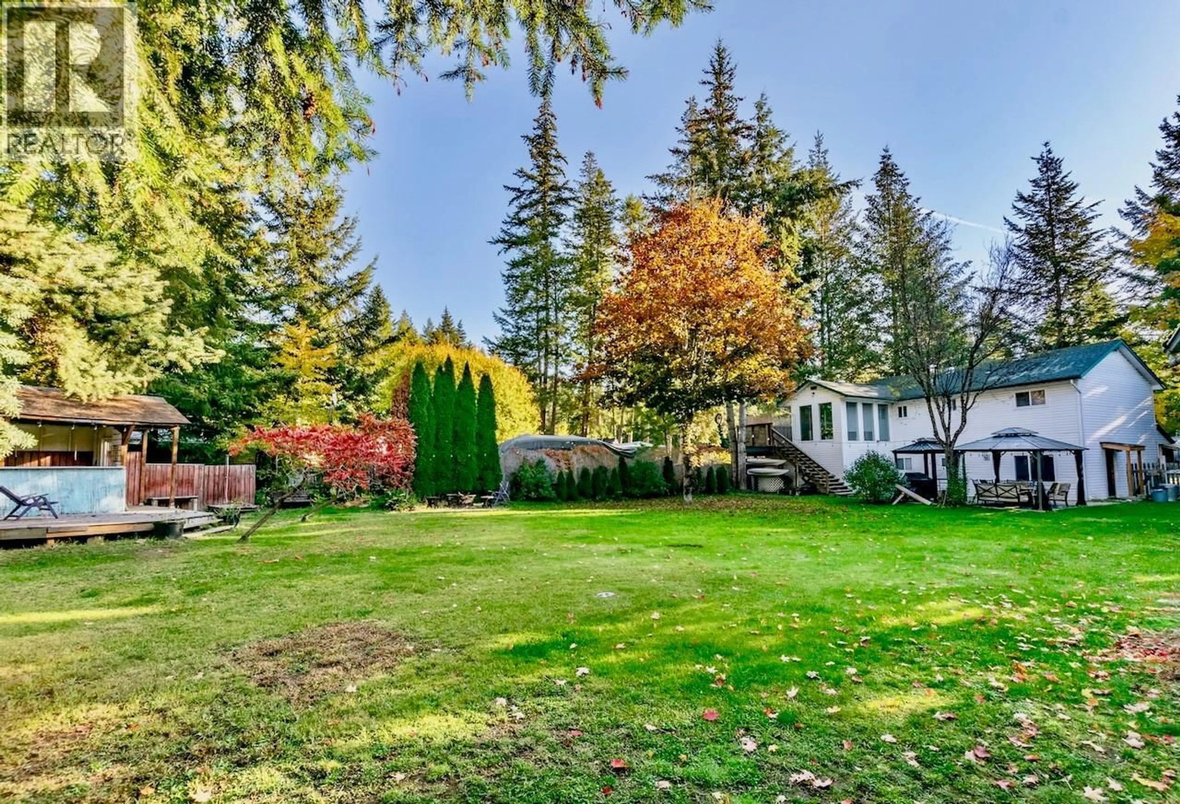 A pic from outside/outdoor area/front of a property/back of a property/a pic from drone, forest/trees view for 4179 ASHE CRESCENT, Scotch Creek British Columbia V0E1M5