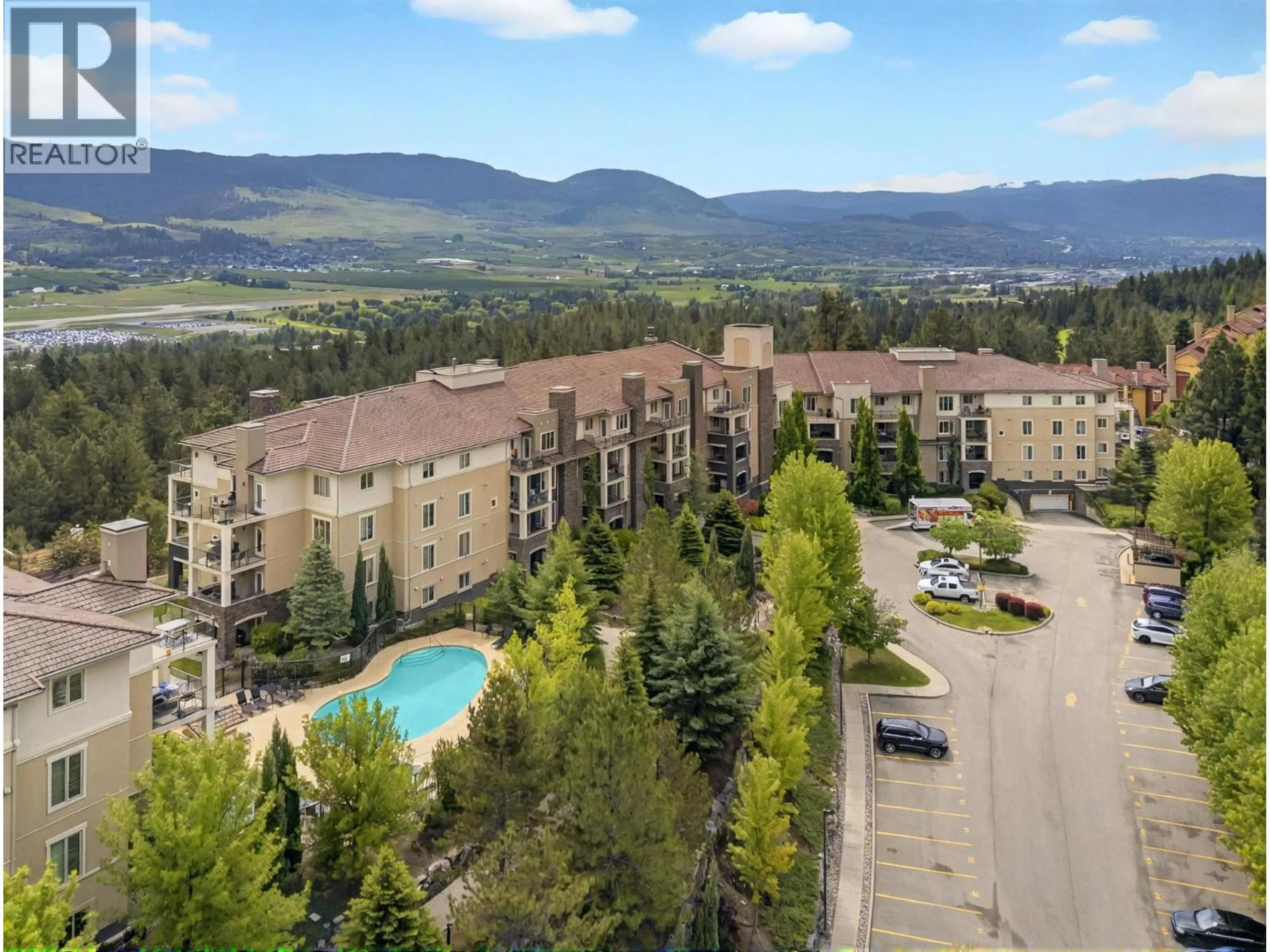 A pic from outside/outdoor area/front of a property/back of a property/a pic from drone, mountain view for 2206 - 1873 COUNTRY CLUB DRIVE, Kelowna British Columbia V1V2W6