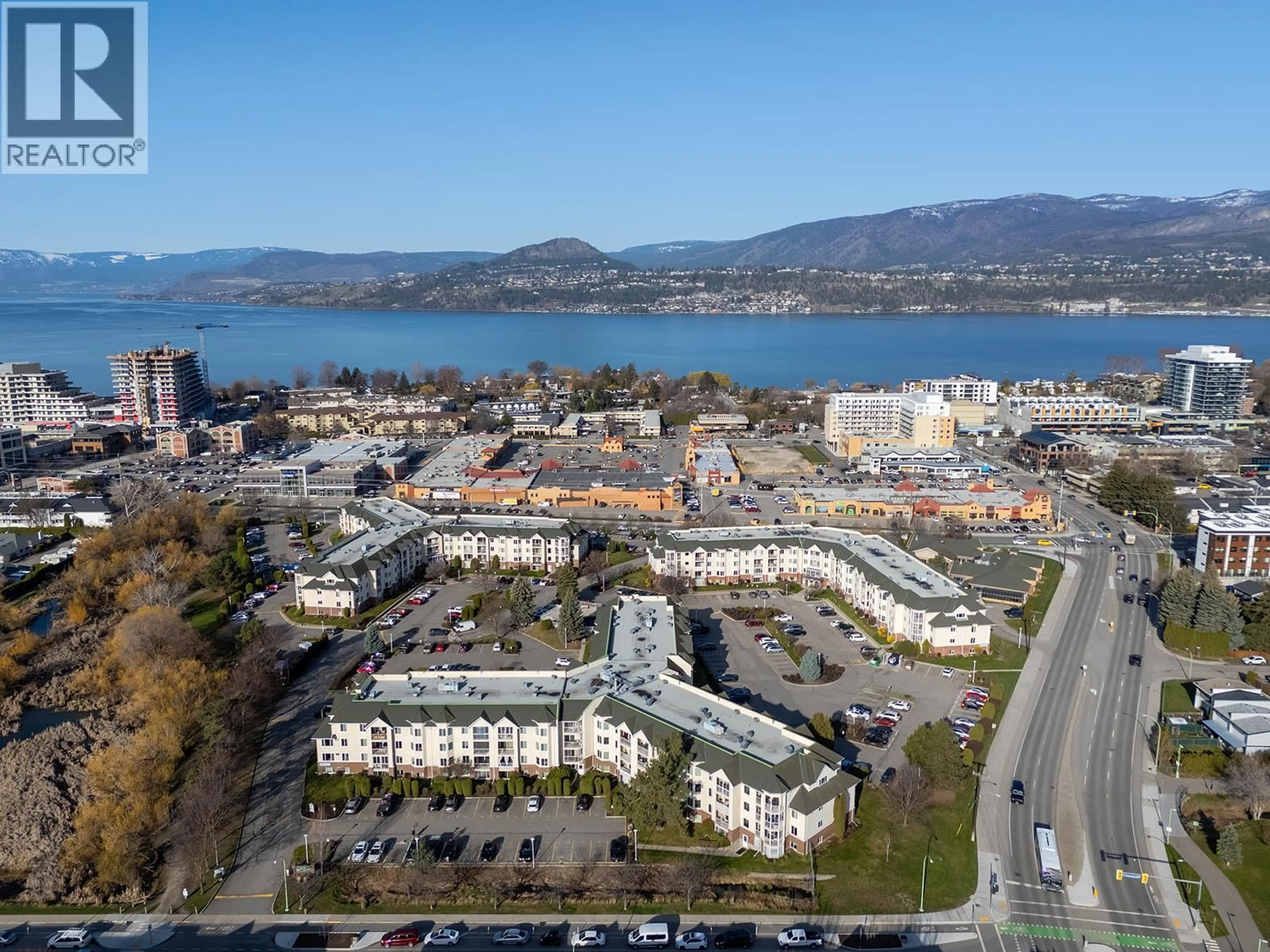 A pic from outside/outdoor area/front of a property/back of a property/a pic from drone, water/lake/river/ocean view for 203 - 769 KLO ROAD, Kelowna British Columbia V1Y9L9