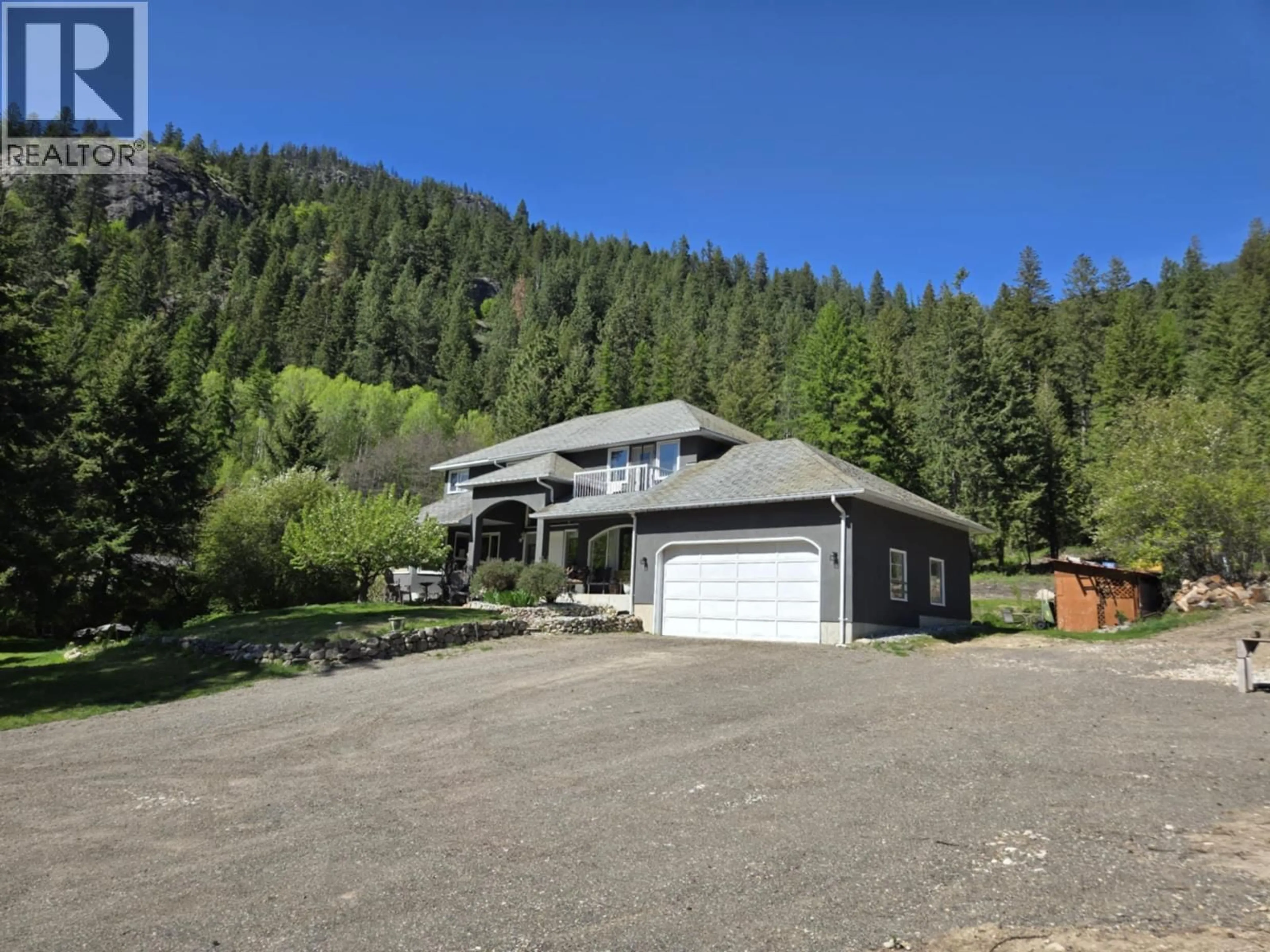 A pic from outside/outdoor area/front of a property/back of a property/a pic from drone, mountain view for 5407 ALLENDALE CRESCENT, Castlegar British Columbia V1N4V8