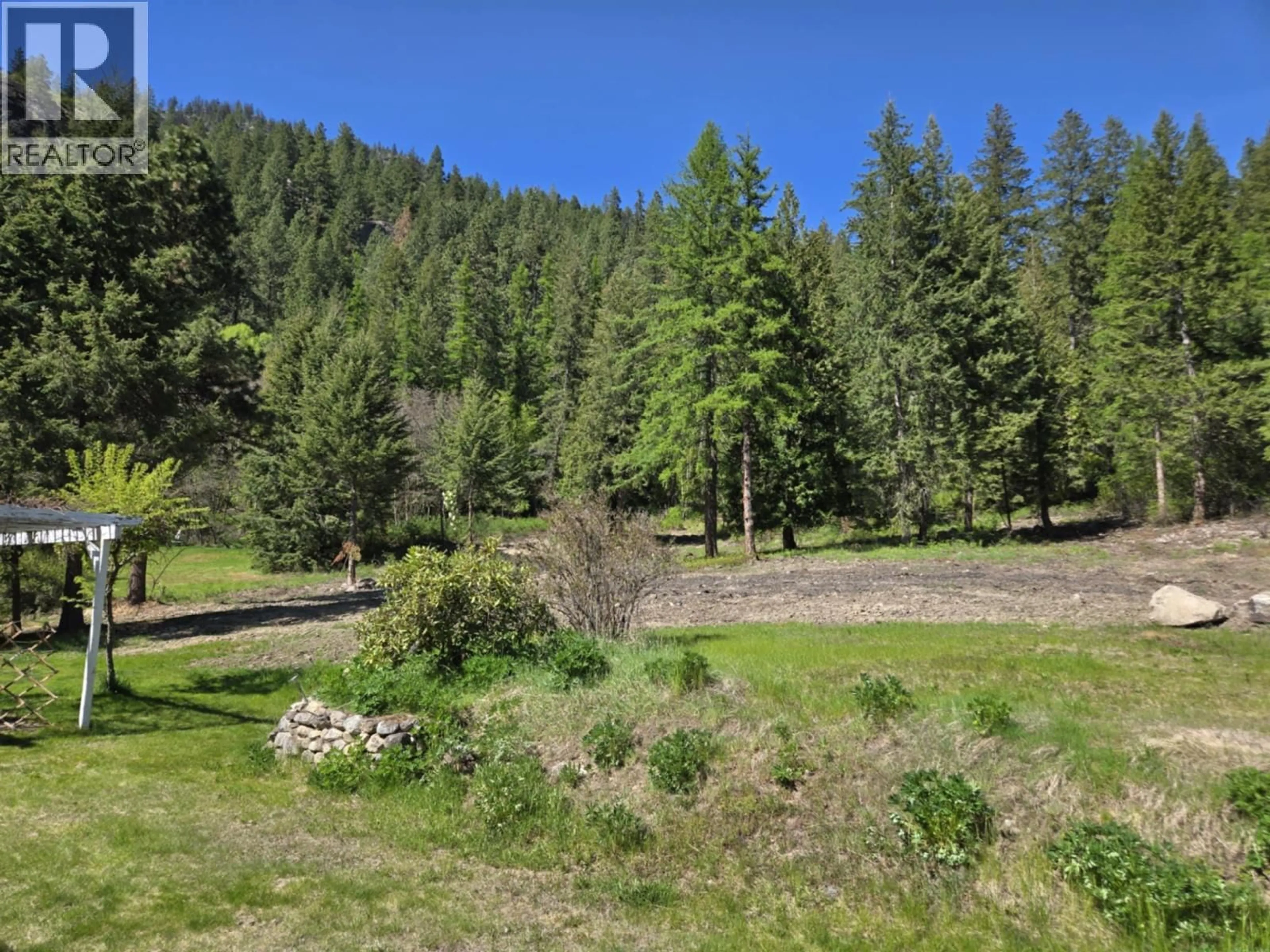 A pic from outside/outdoor area/front of a property/back of a property/a pic from drone, forest/trees view for 5407 ALLENDALE CRESCENT, Castlegar British Columbia V1N4V8
