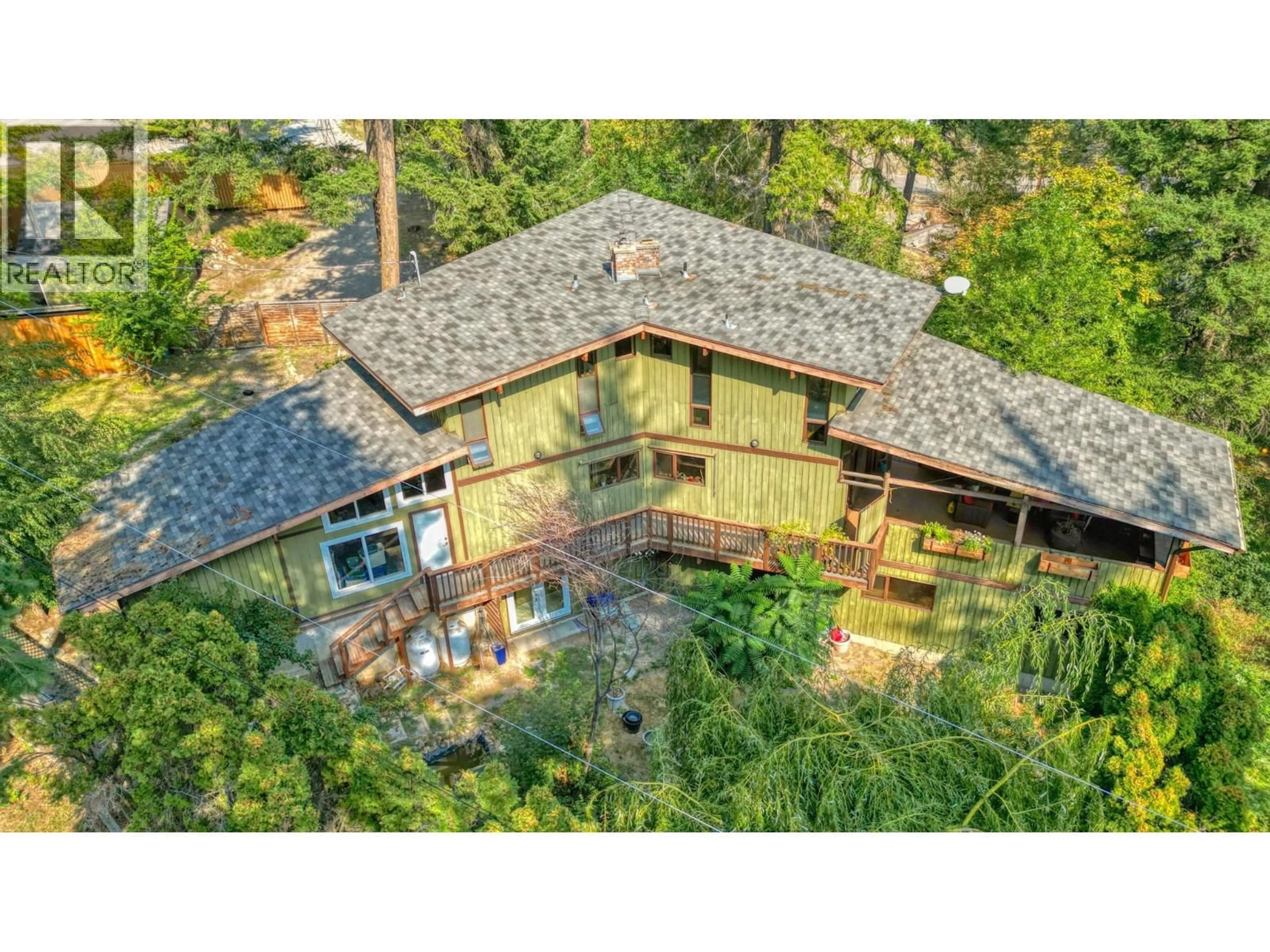 A pic from outside/outdoor area/front of a property/back of a property/a pic from drone, forest/trees view for 405 KILDARE WAY, Vernon British Columbia V1T2C7