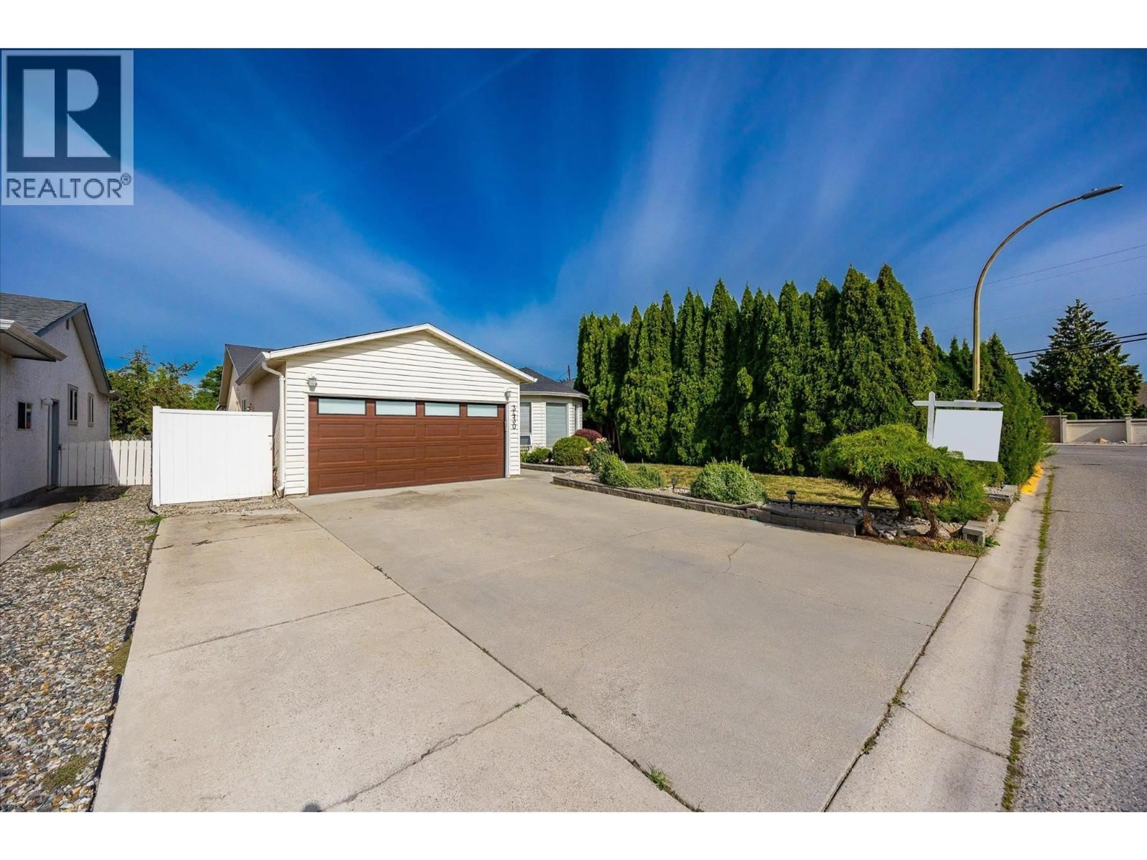 A pic from outside/outdoor area/front of a property/back of a property/a pic from drone, street for 3430 SILVERBERRY ROAD, Kelowna British Columbia V1W3V5
