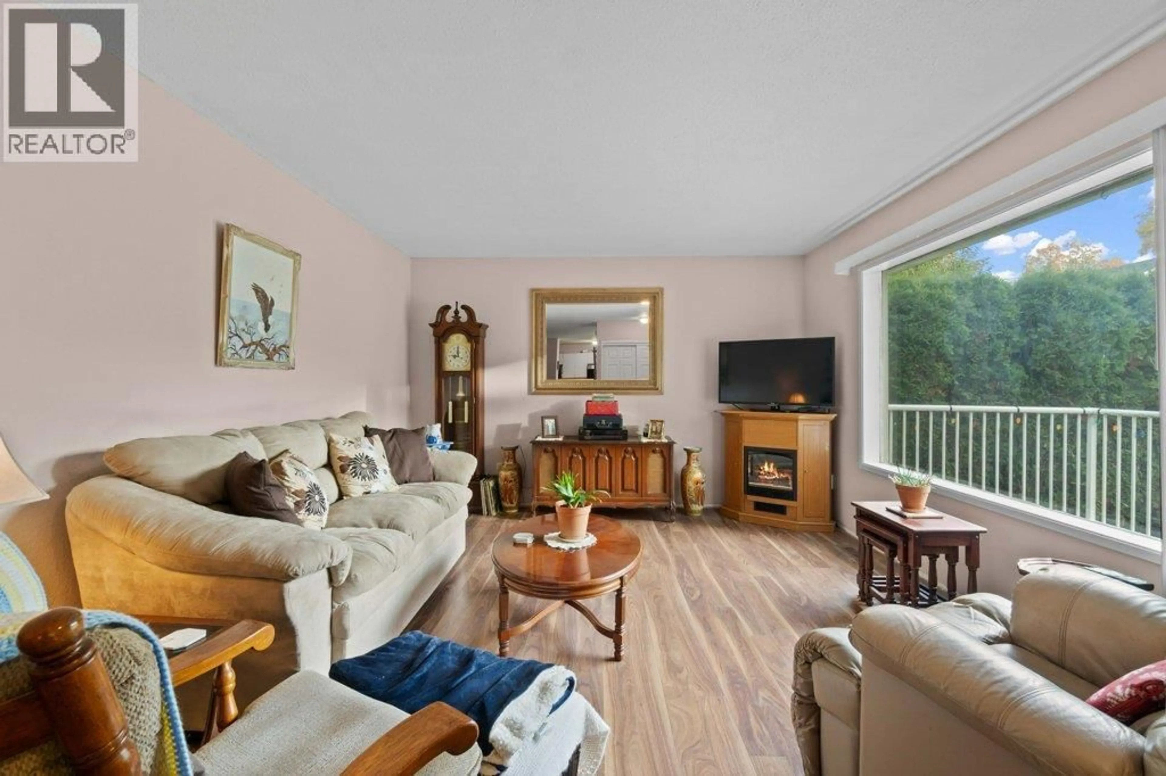 Living room with furniture, wood/laminate floor for 341 2 STREET SOUTHEAST, Salmon Arm British Columbia V1E4H3