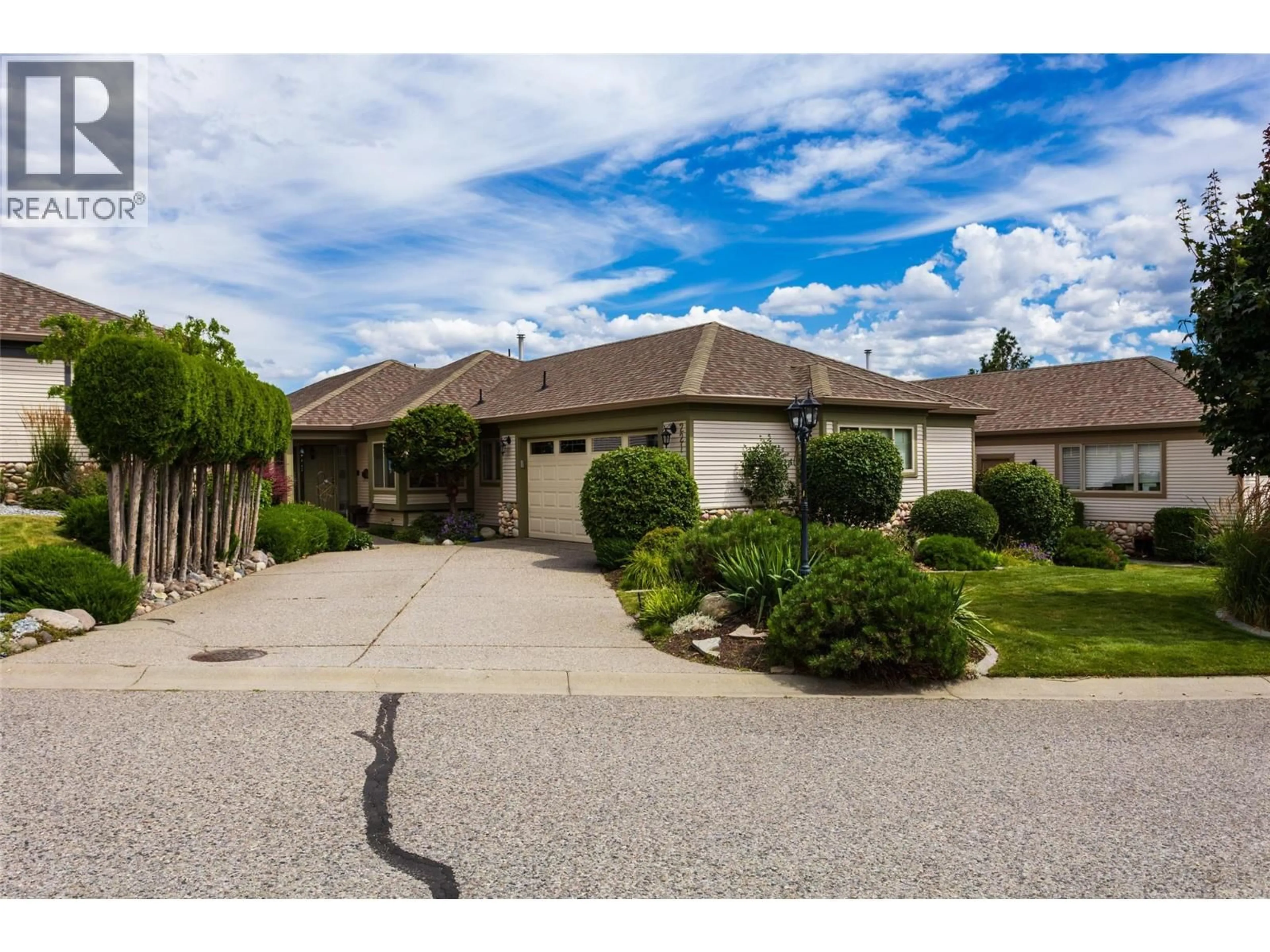 A pic from outside/outdoor area/front of a property/back of a property/a pic from drone, street for 221 - 4074 GELLATLY ROAD, West Kelowna British Columbia V4T2S8