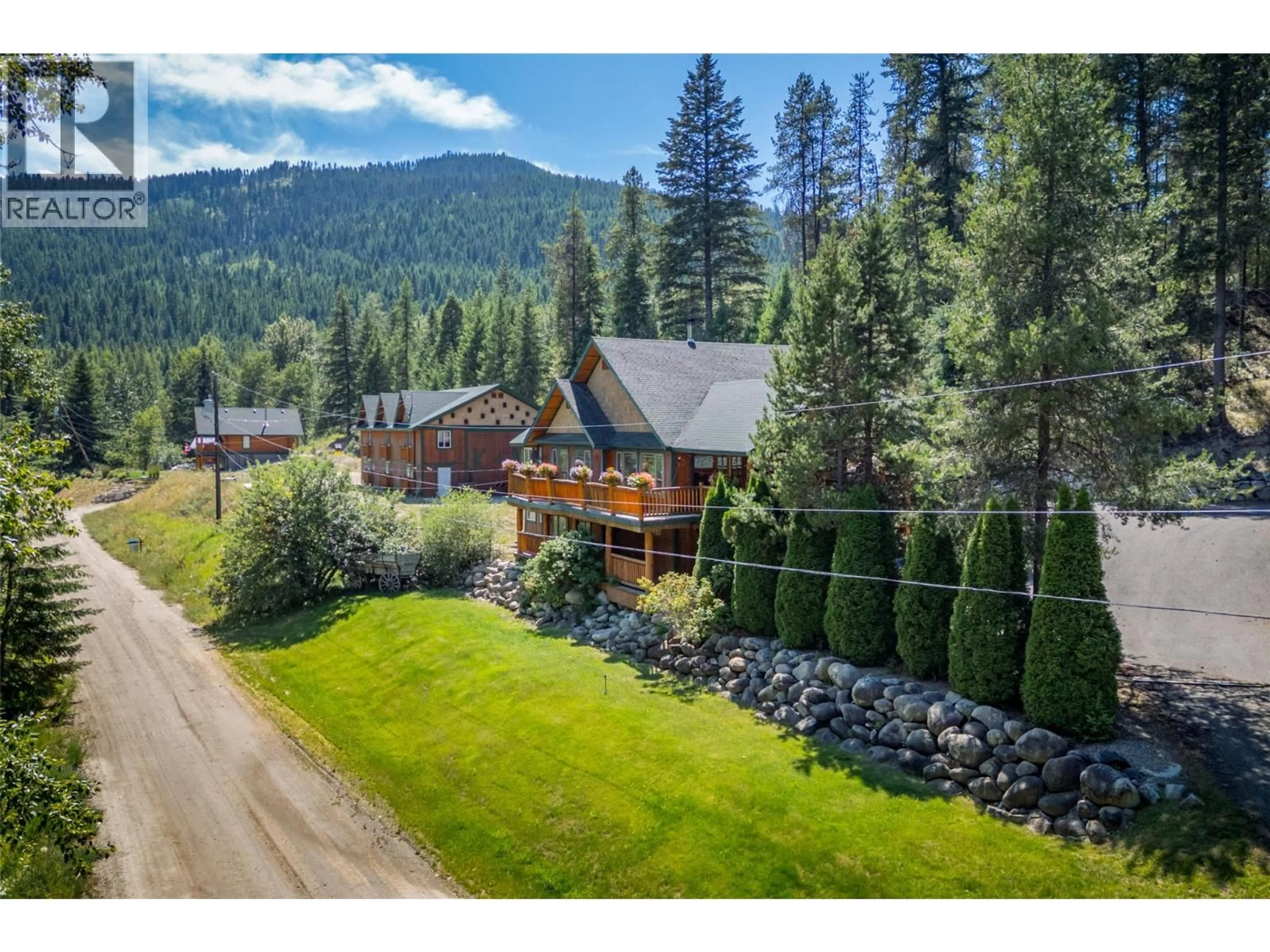 A pic from outside/outdoor area/front of a property/back of a property/a pic from drone, mountain view for 95 & 105 DALE AVENUE, Carmi British Columbia V0H1A0