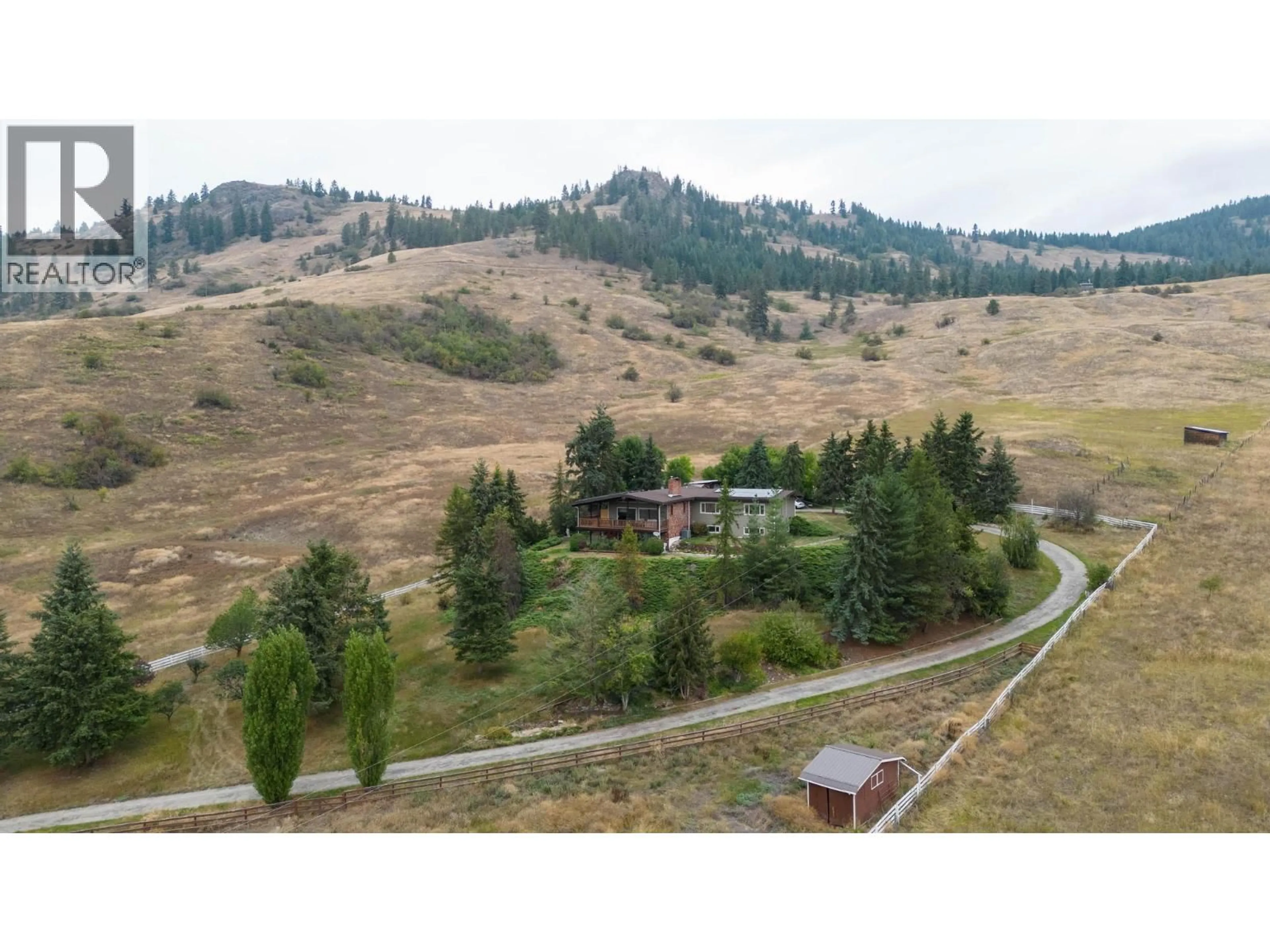A pic from outside/outdoor area/front of a property/back of a property/a pic from drone, mountain view for 2545 6 HIGHWAY, Lumby British Columbia V0E2G1