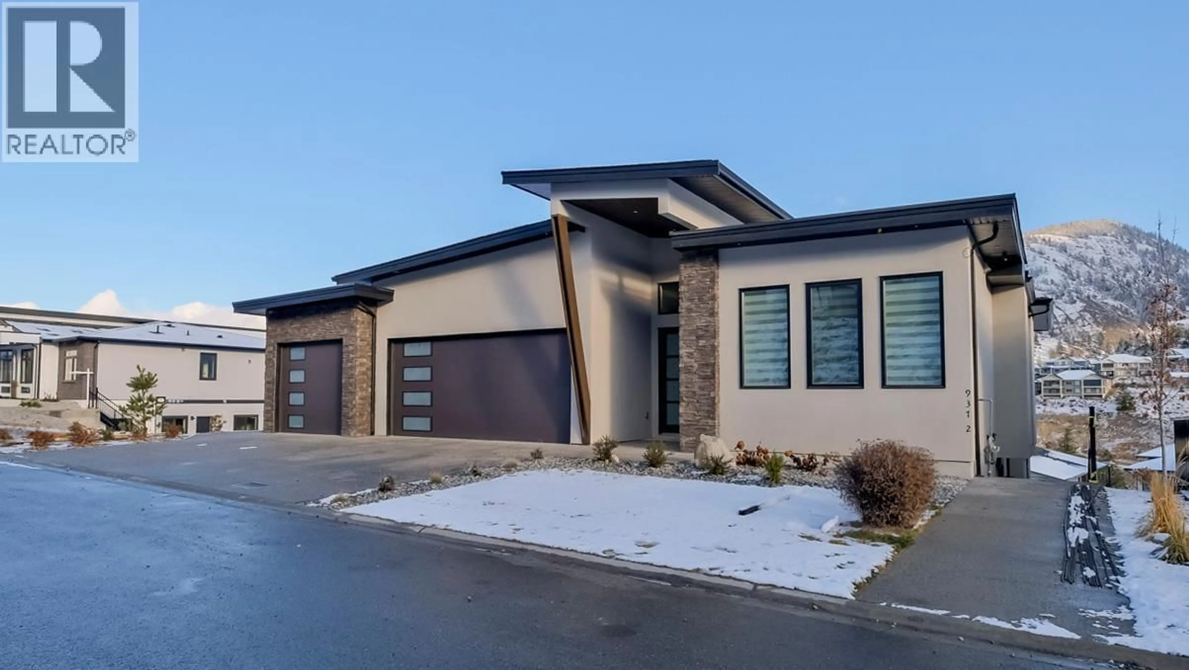 Home with brick exterior material, street for 937 ROYAL TROON LANE, Kelowna British Columbia V1P0A3