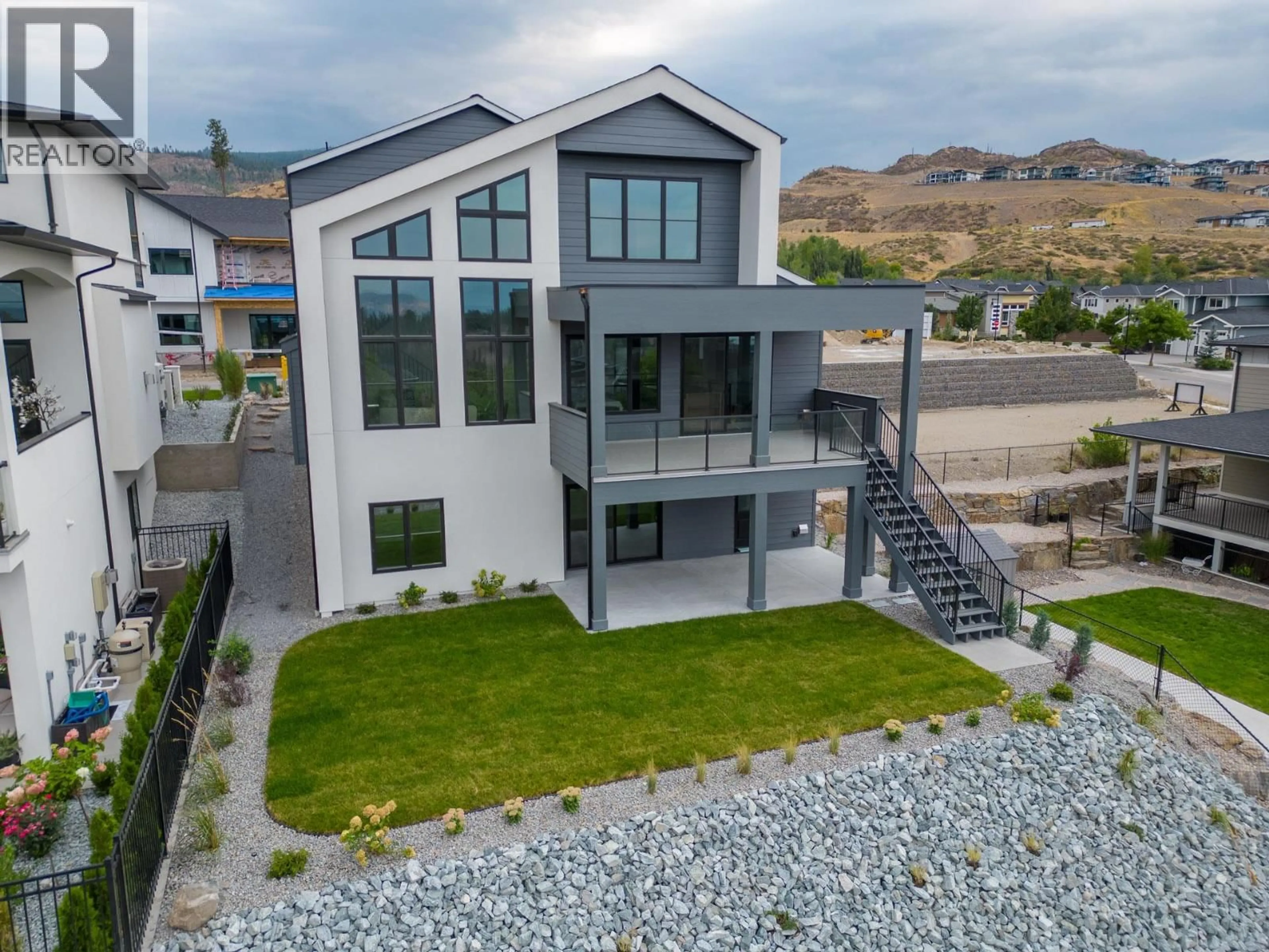 A pic from outside/outdoor area/front of a property/back of a property/a pic from drone, mountain view for 4964 BUCKTAIL LANE, Kelowna British Columbia V1W5L3