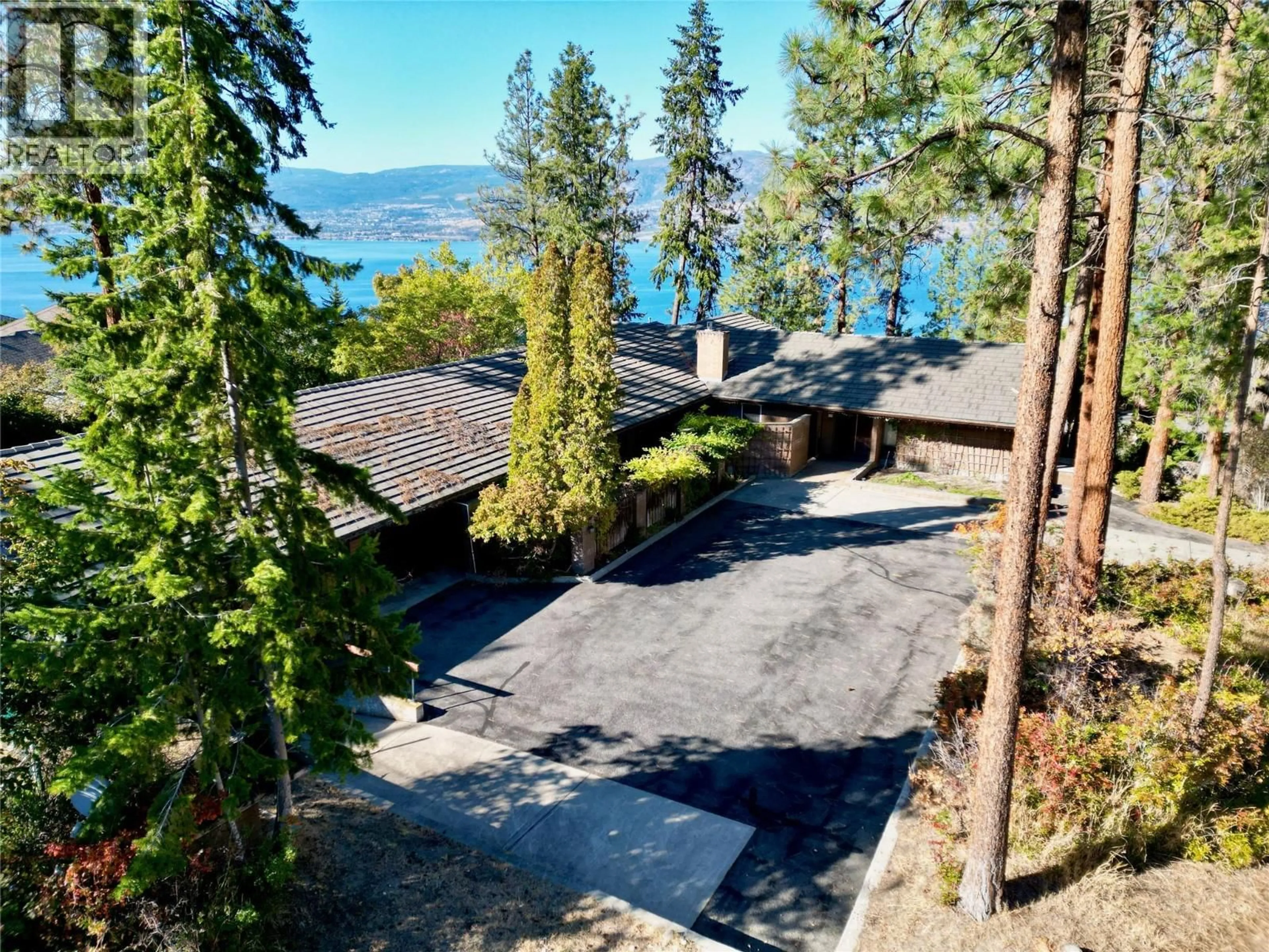 A pic from outside/outdoor area/front of a property/back of a property/a pic from drone, water/lake/river/ocean view for 5090 ASH ROAD, Kelowna British Columbia V1W4K1