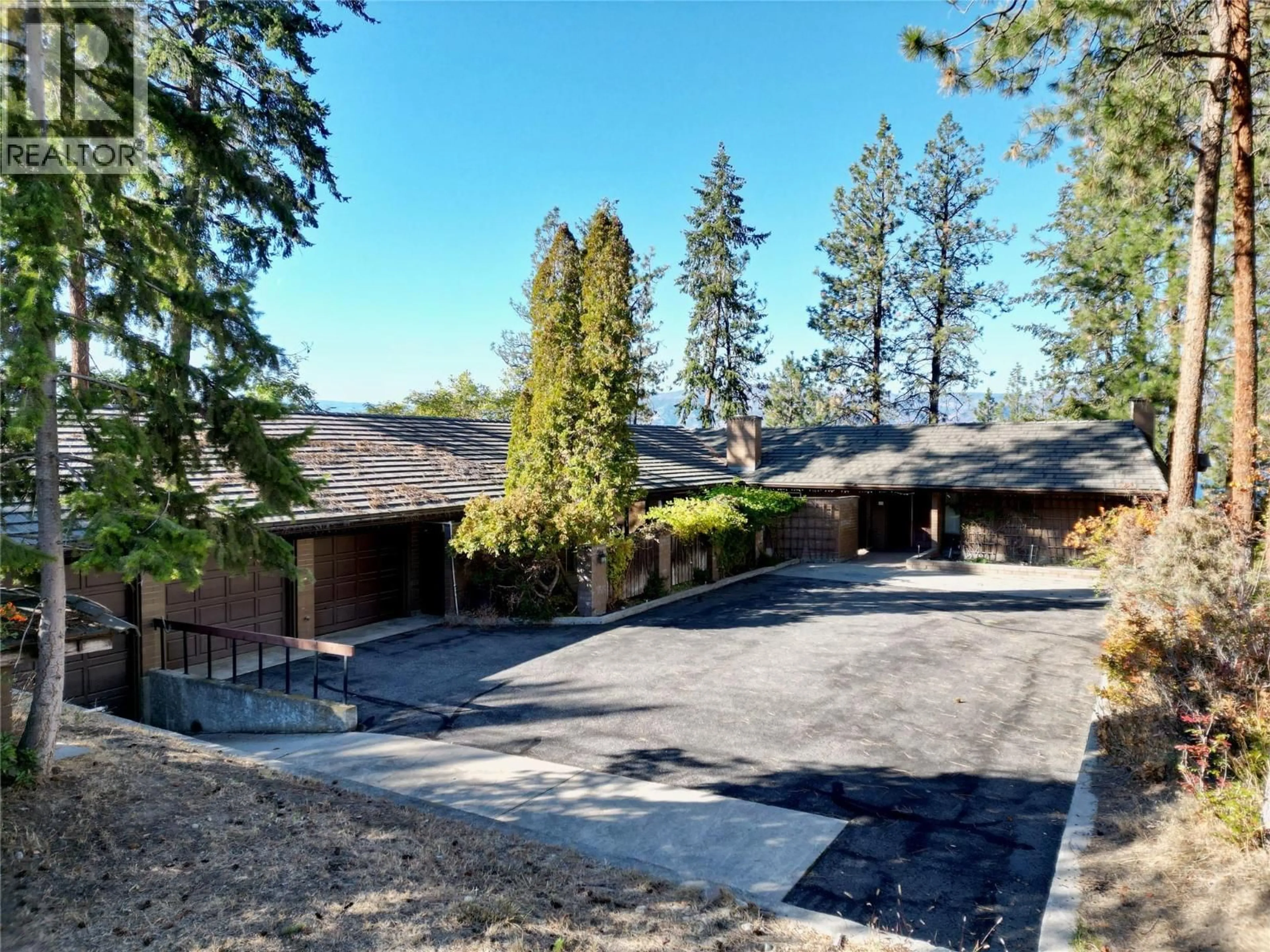 A pic from outside/outdoor area/front of a property/back of a property/a pic from drone, mountain view for 5090 ASH ROAD, Kelowna British Columbia V1W4K1