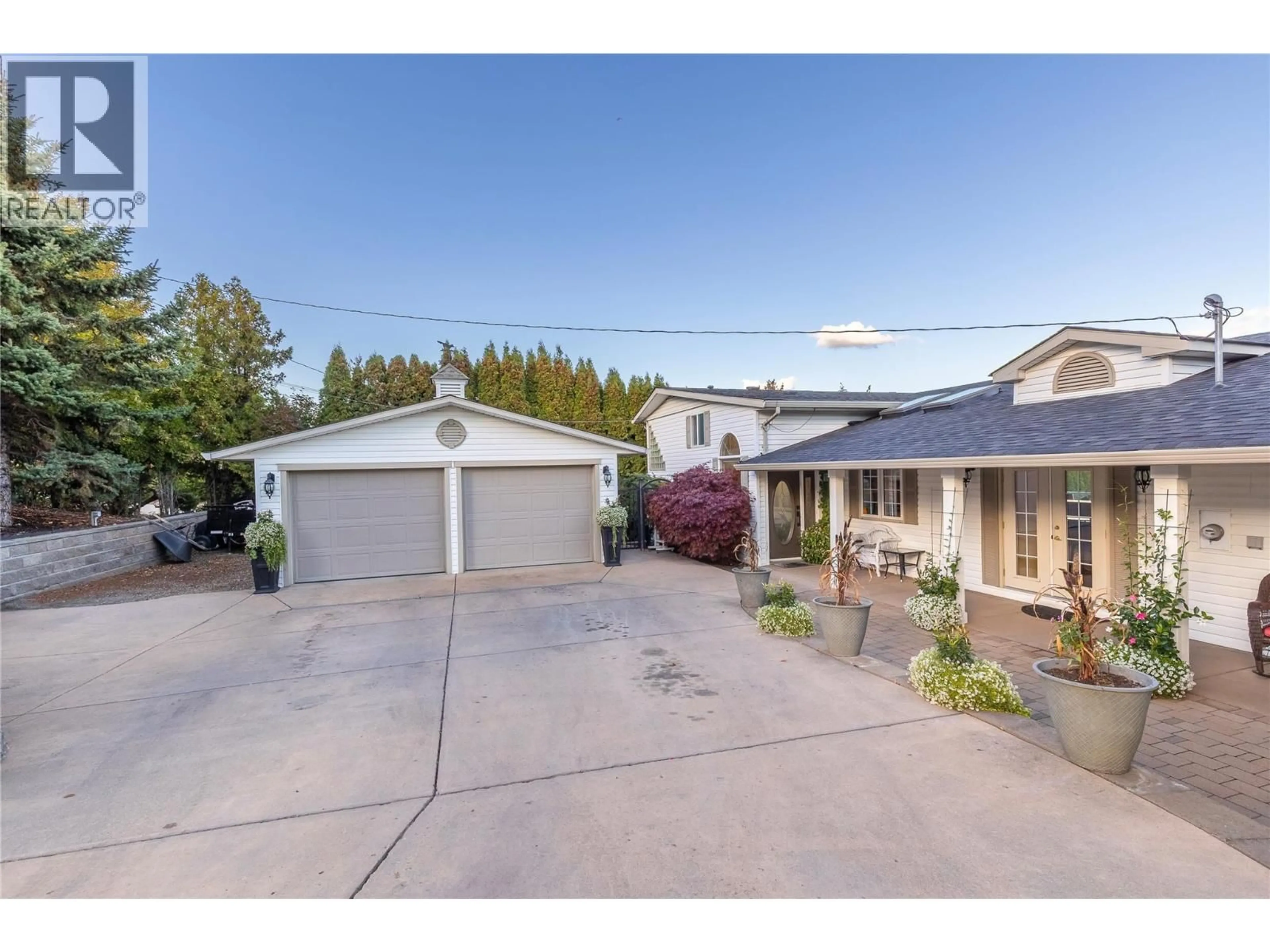 A pic from outside/outdoor area/front of a property/back of a property/a pic from drone, street for 13709 NASH DRIVE, Coldstream British Columbia V1B1X9
