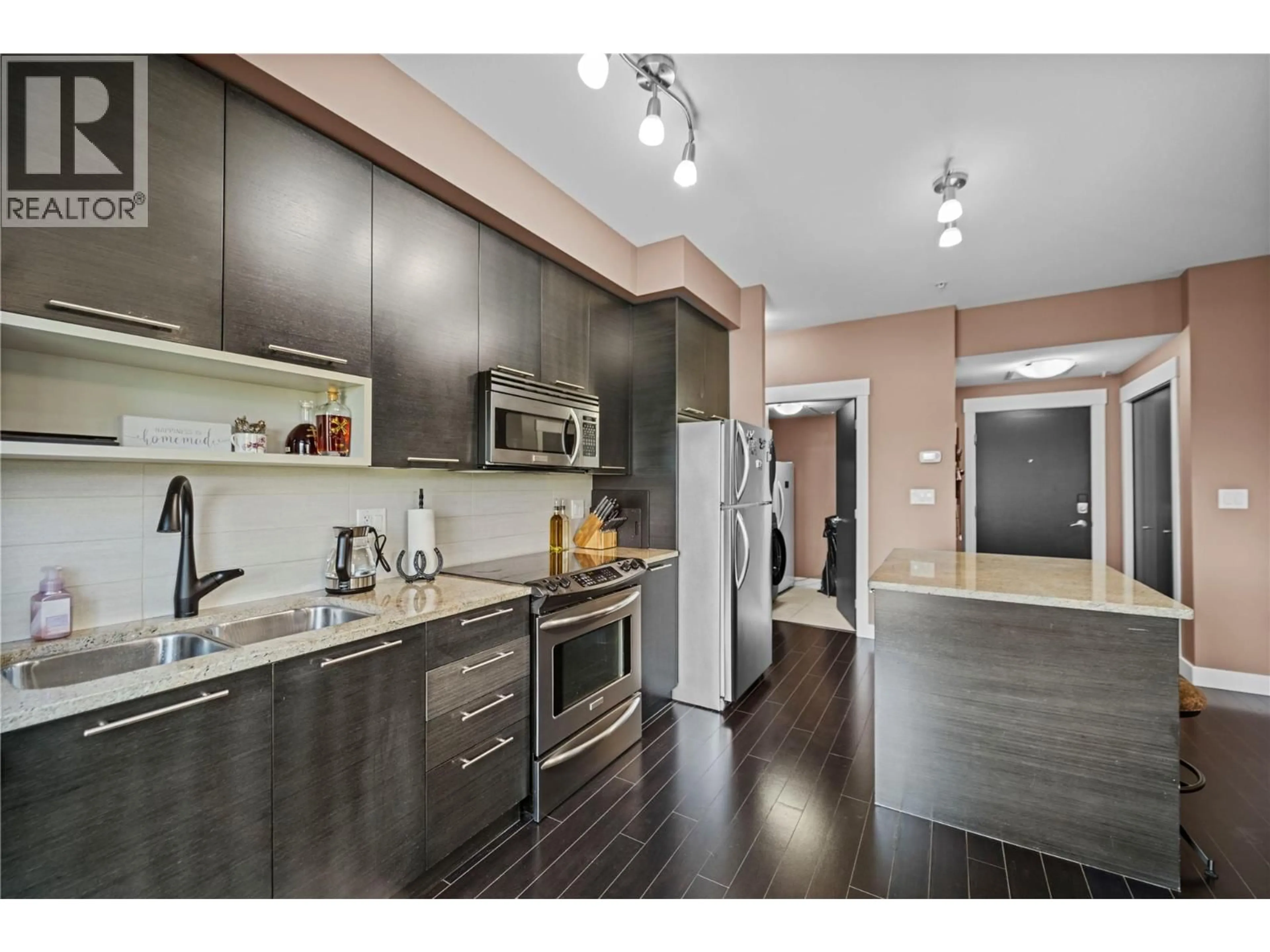 Open concept kitchen, wood/laminate floor for 1312 - 1000 TALASA WAY, Kamloops British Columbia V2H0C2