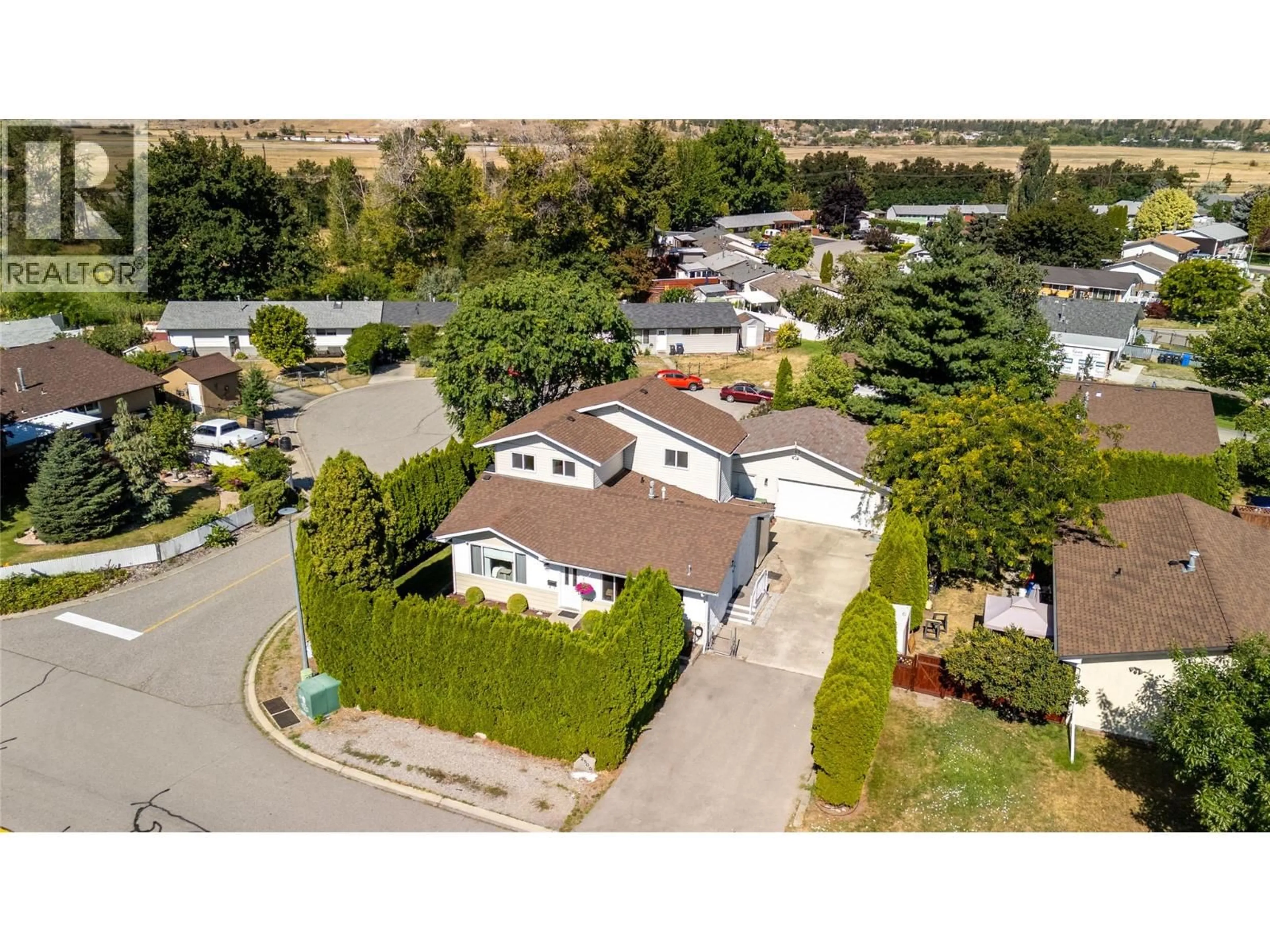 A pic from outside/outdoor area/front of a property/back of a property/a pic from drone, street for 2509 CORNWALL DRIVE, Penticton British Columbia V2A6R8