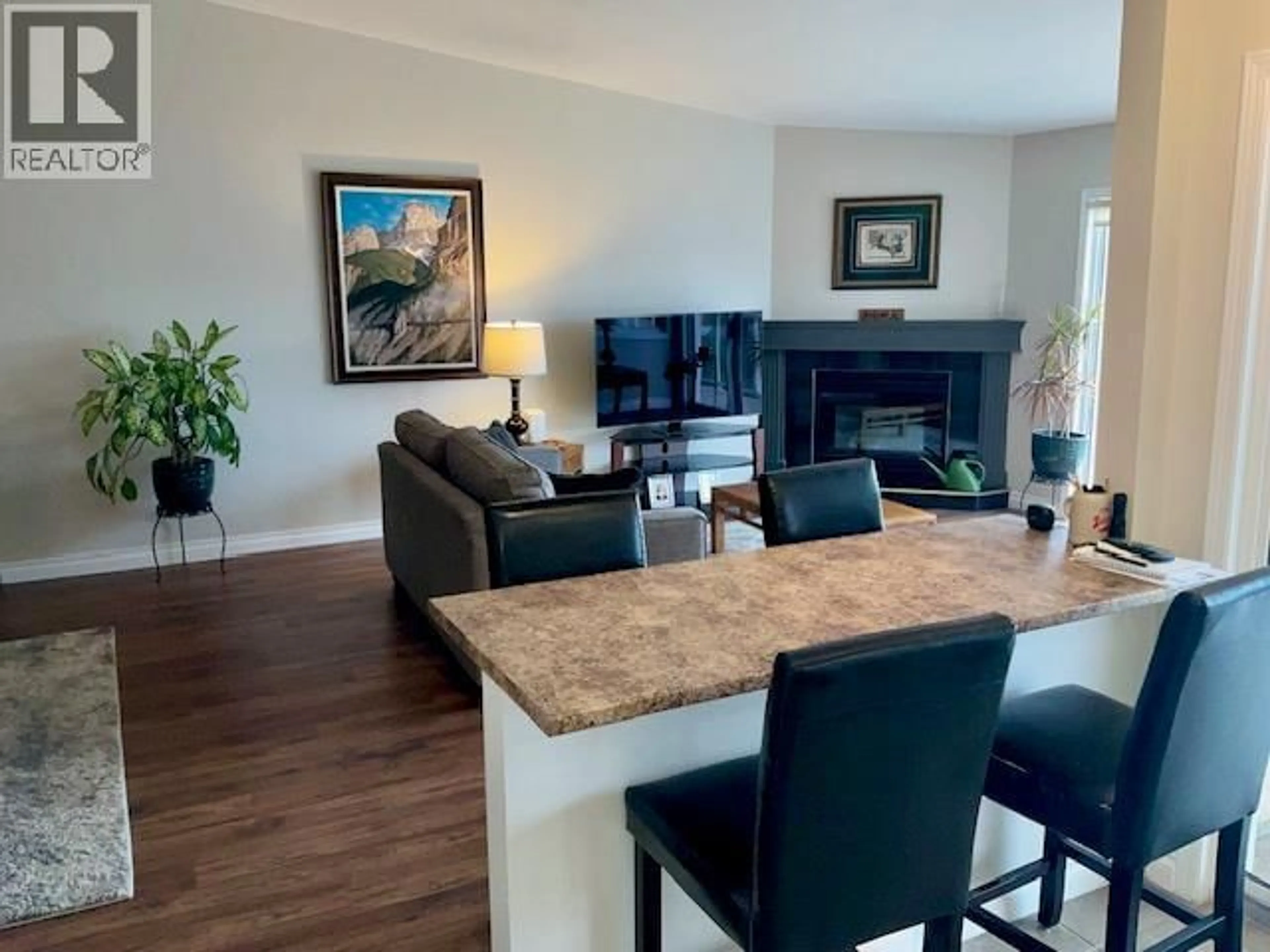 Living room with furniture, wood/laminate floor for 204 - 4450 PONDEROSA DRIVE, Peachland British Columbia V0H1X5