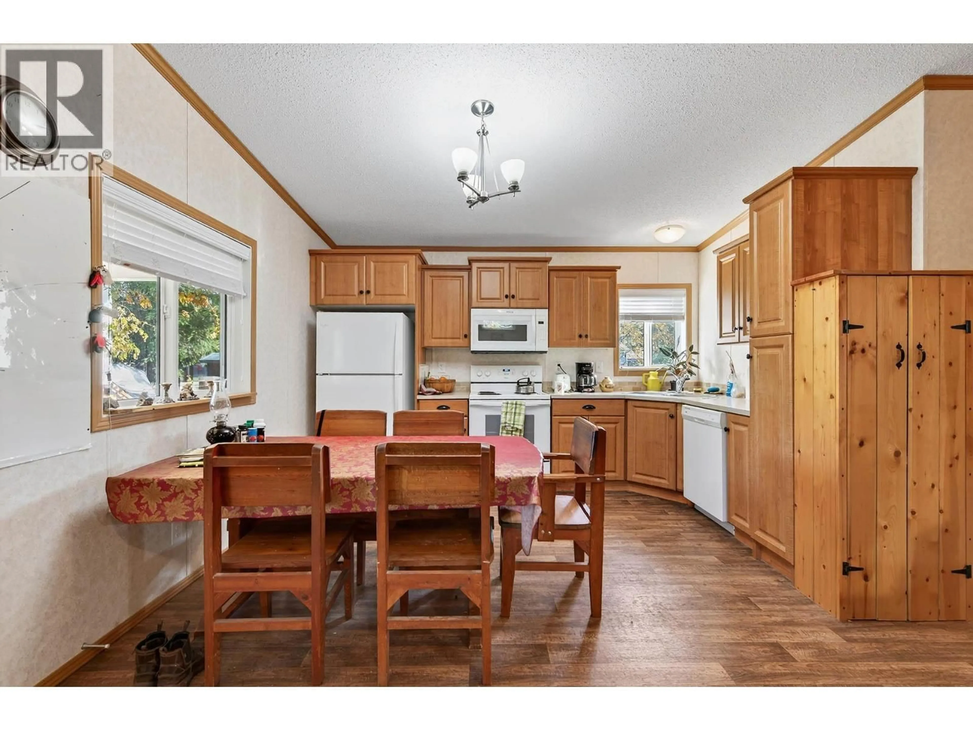 Open concept kitchen, wood/laminate floor for 436 HYDRO ROAD, Clearwater British Columbia V0E1N1