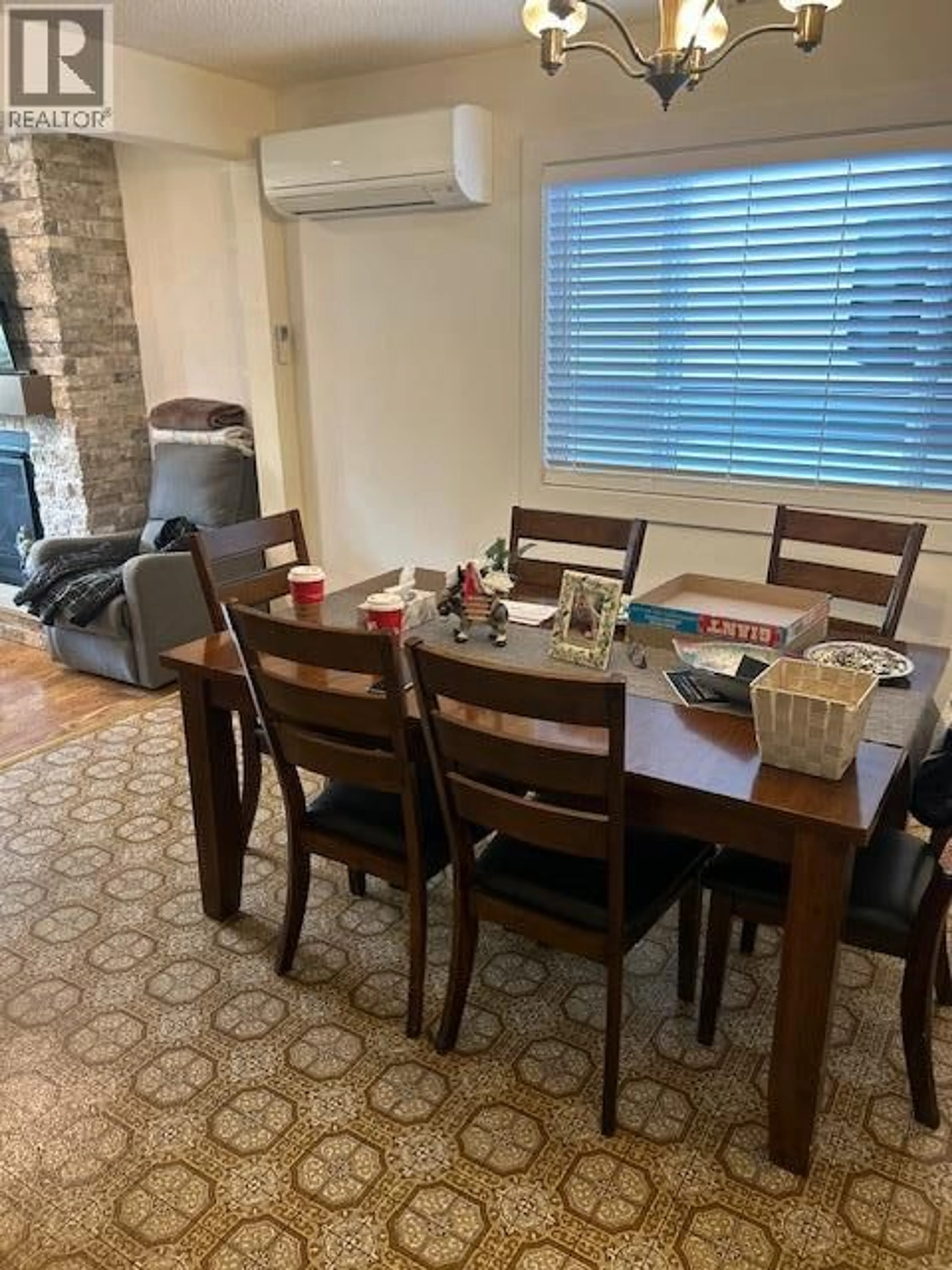 Dining room, wood/laminate floor for 3537 LAKESHORE ROAD, Kelowna British Columbia V1W3K1