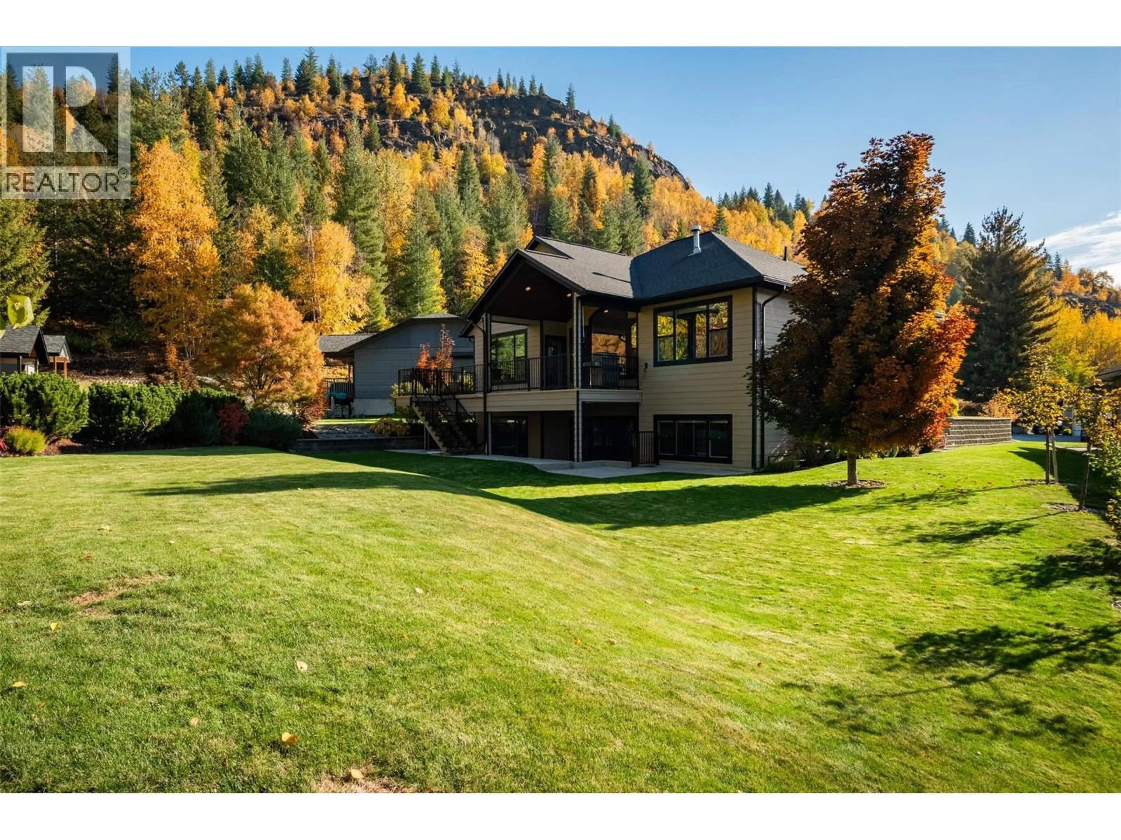 A pic from outside/outdoor area/front of a property/back of a property/a pic from drone, mountain view for 7912 BIRCHWOOD DRIVE, Trail British Columbia V1R4Y4