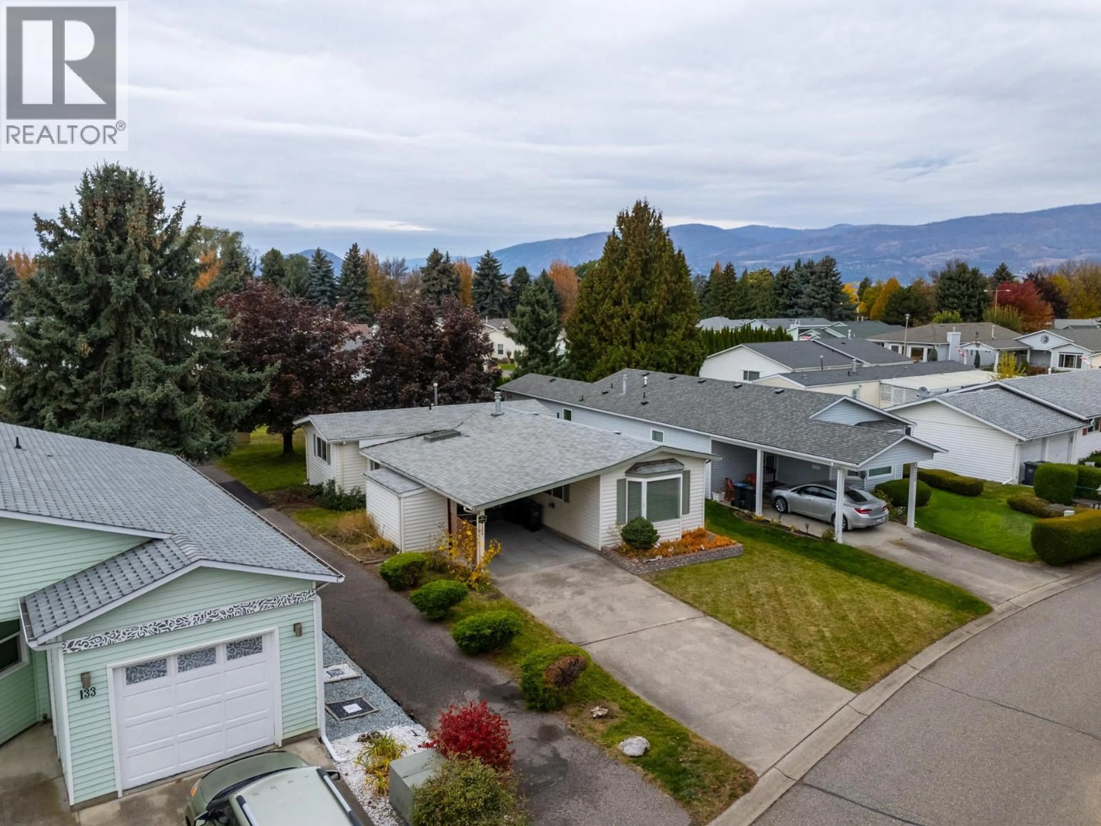 A pic from outside/outdoor area/front of a property/back of a property/a pic from drone, mountain view for 134 - 1255 RAYMER AVENUE, Kelowna British Columbia V1W3P8