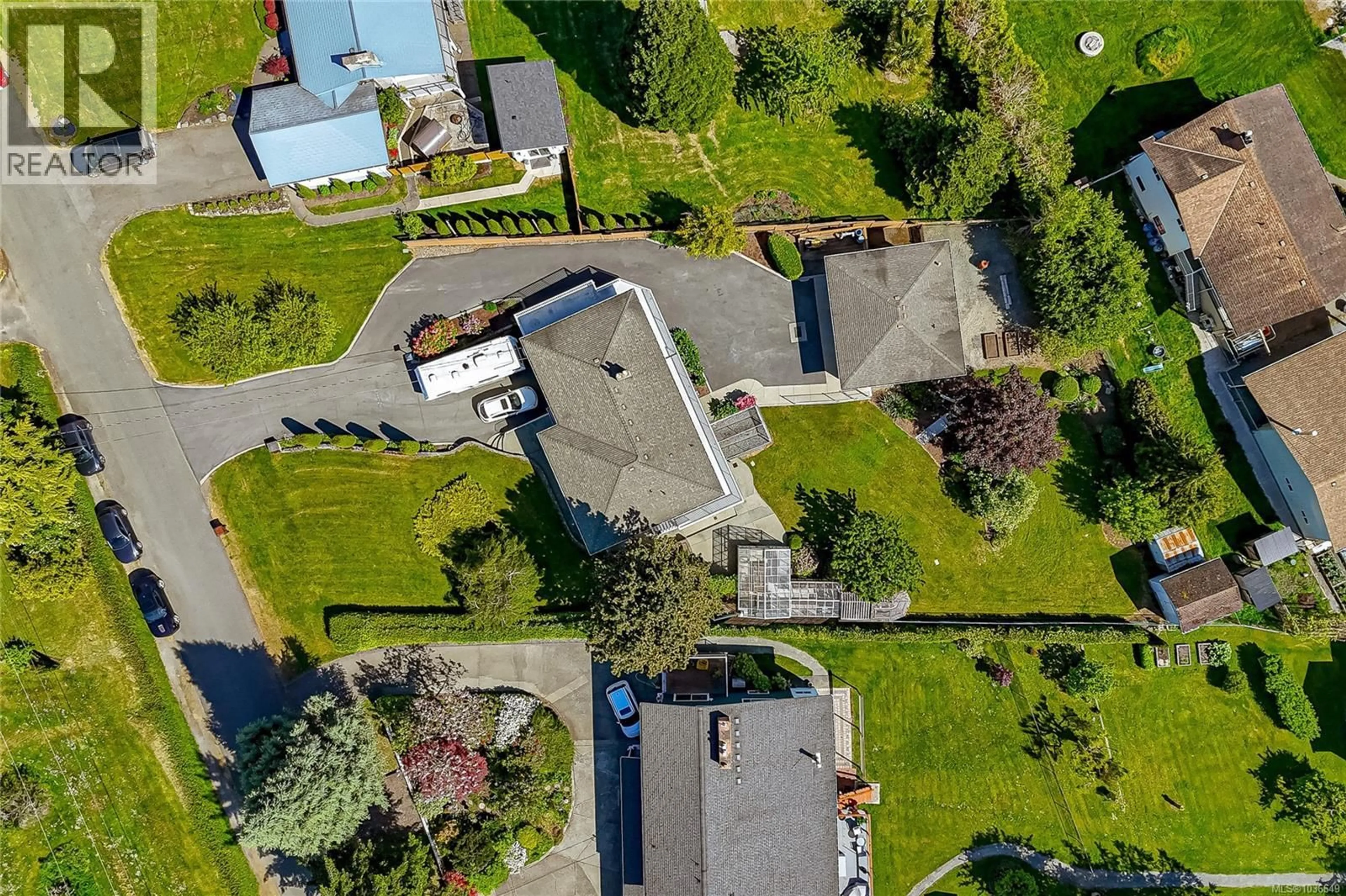 A pic from outside/outdoor area/front of a property/back of a property/a pic from drone, street for 8705 EBOR TERRACE, North Saanich British Columbia V8L1L7