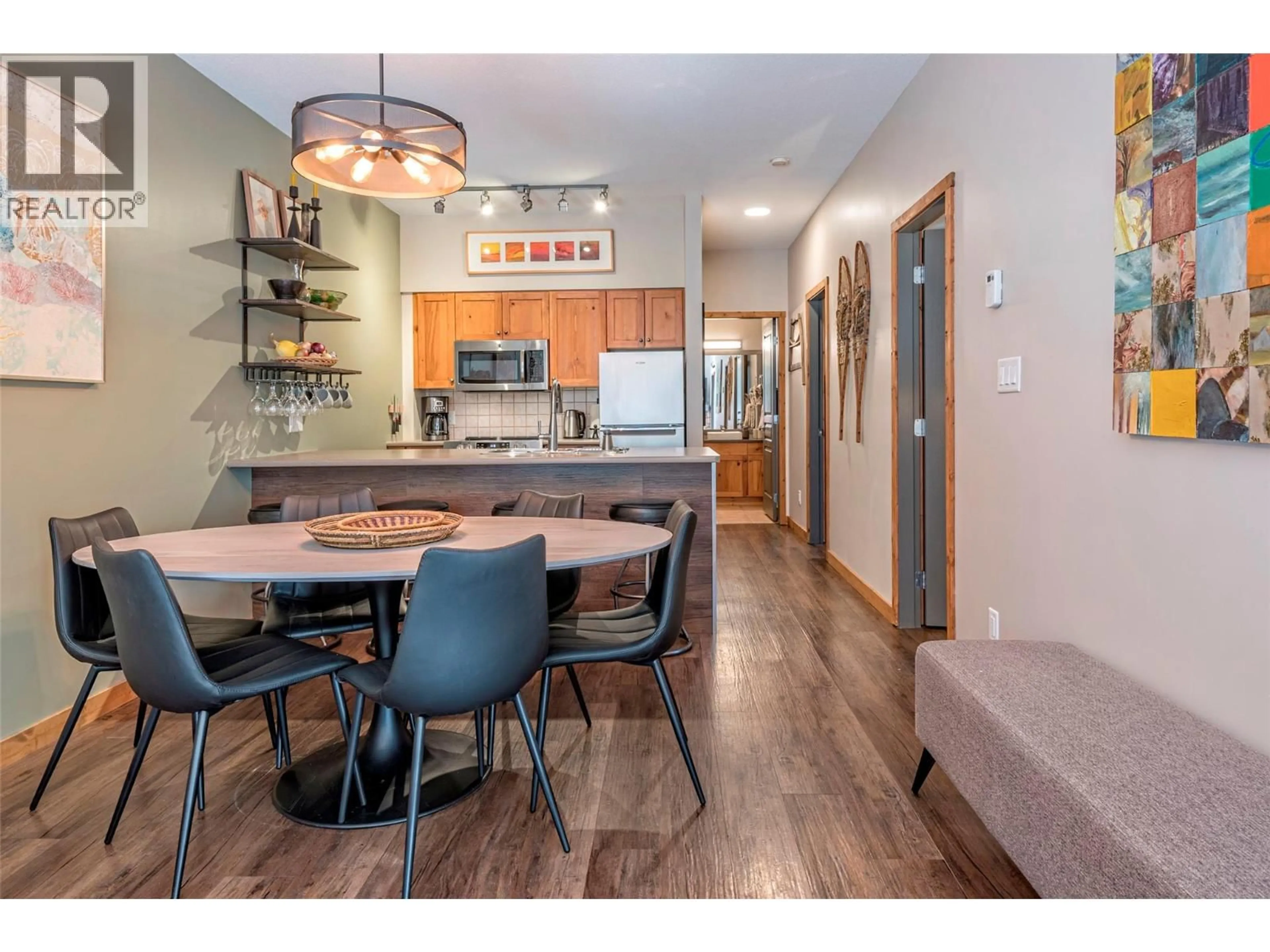 Open concept kitchen, wood/laminate floor for 109 - 9808 SILVER STAR ROAD, Vernon British Columbia V1B3X4