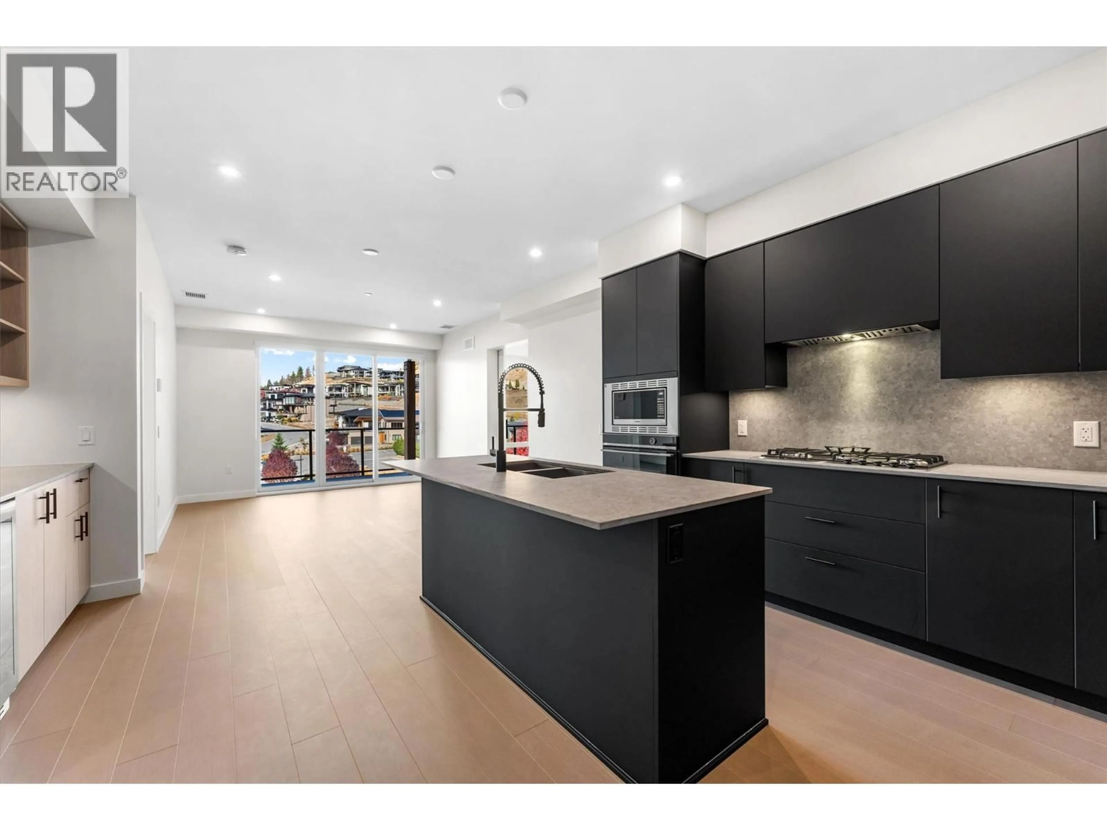 Open concept kitchen, unknown for 407 - 9654 BENCHLAND ROAD, Lake Country British Columbia V4V0A5