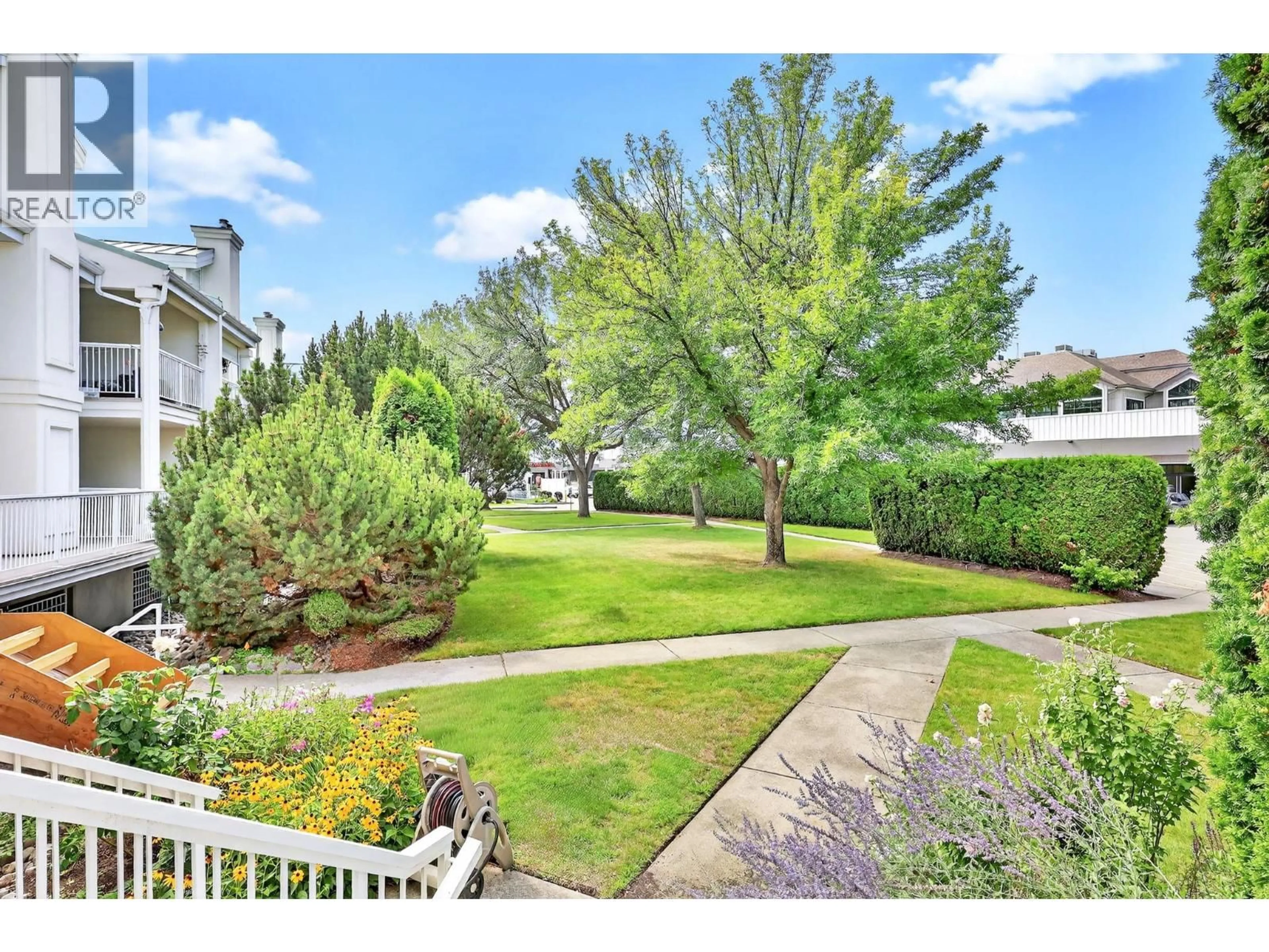 A pic from outside/outdoor area/front of a property/back of a property/a pic from drone, street for 102 - 2350 STILLINGFLEET ROAD, Kelowna British Columbia V1W3X9