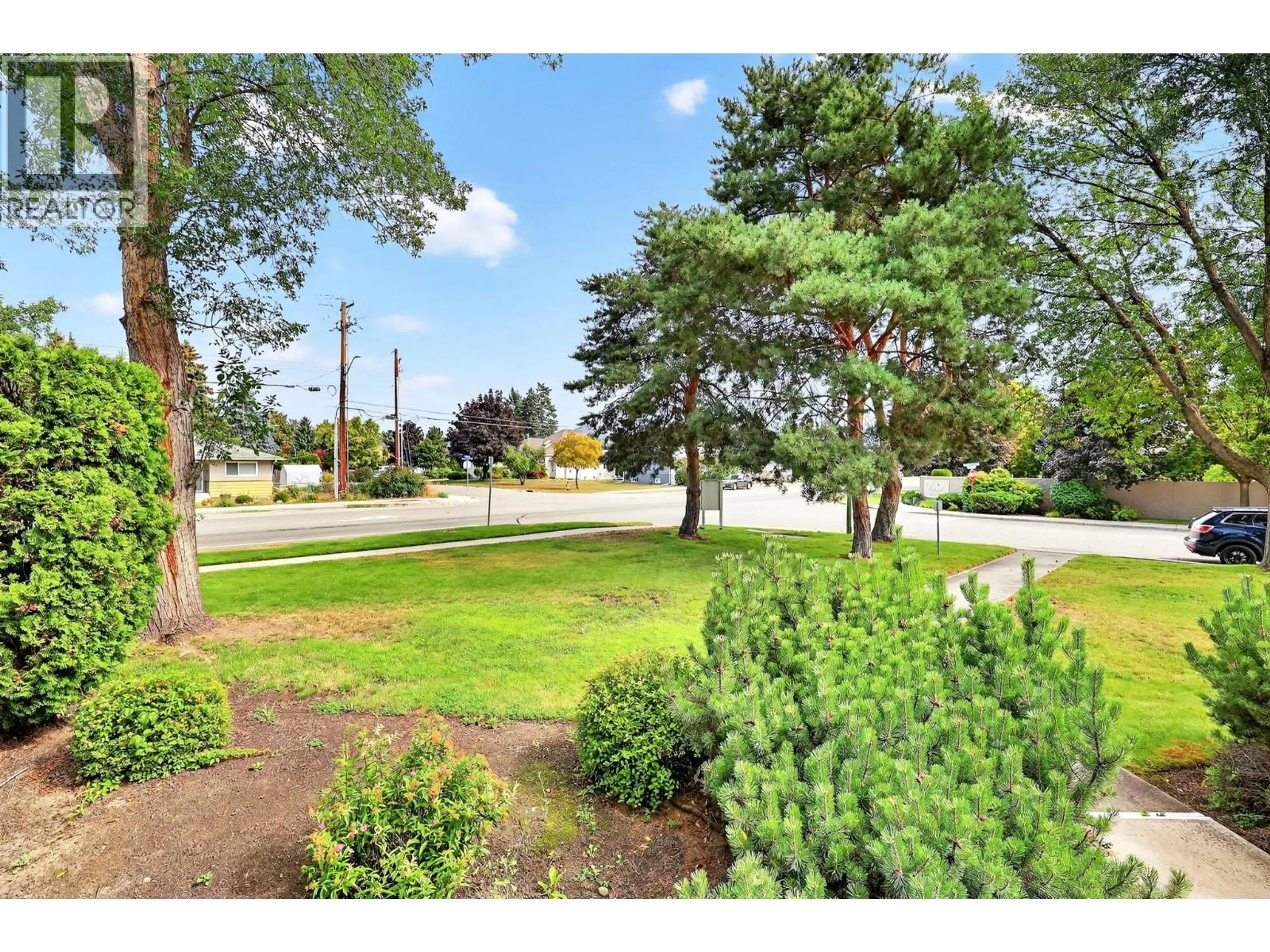 A pic from outside/outdoor area/front of a property/back of a property/a pic from drone, street for 102 - 2350 STILLINGFLEET ROAD, Kelowna British Columbia V1W3X9