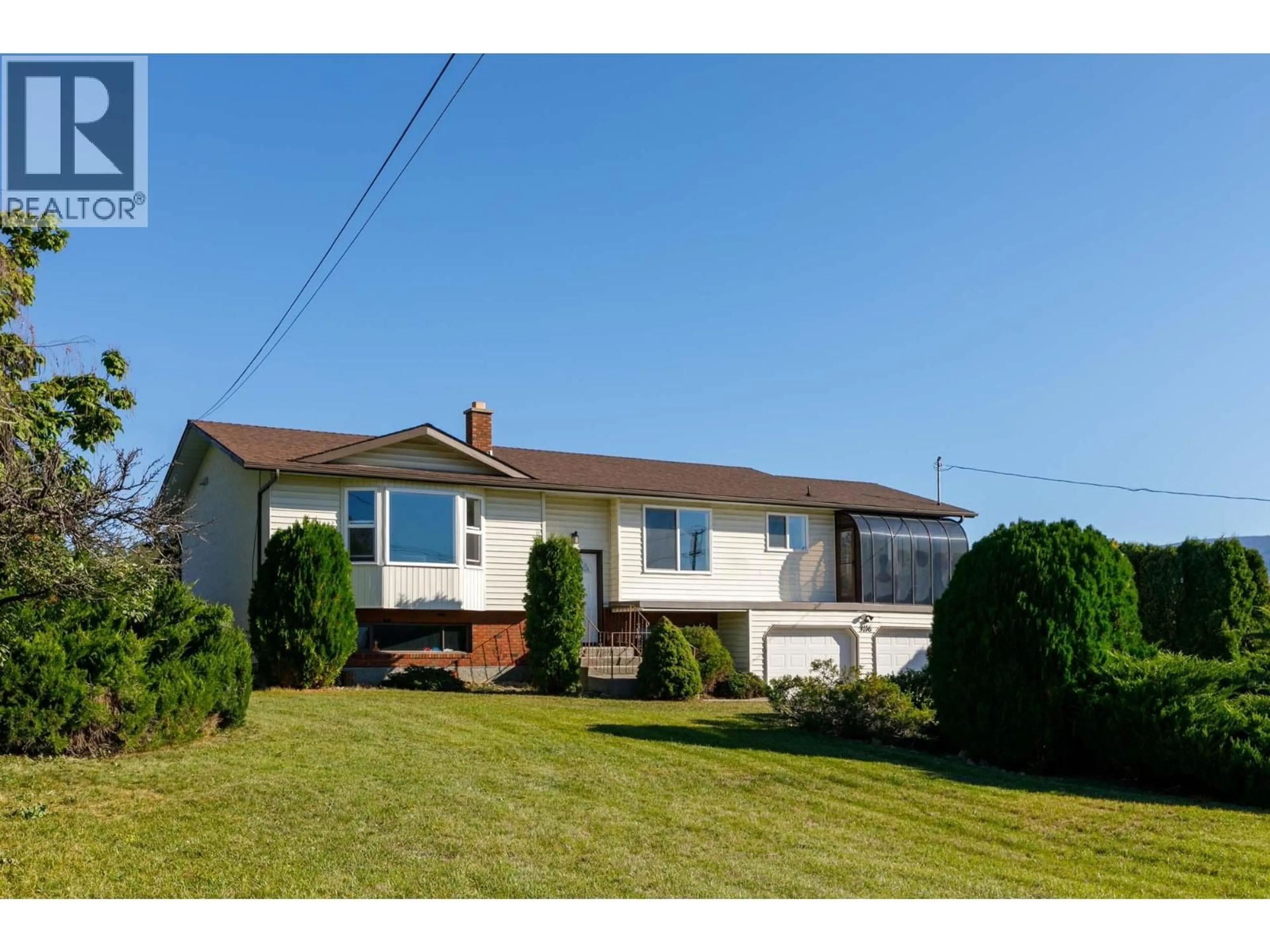 Home with vinyl exterior material, street for 3116 APPALOOSA ROAD, Kelowna British Columbia V1V2G9