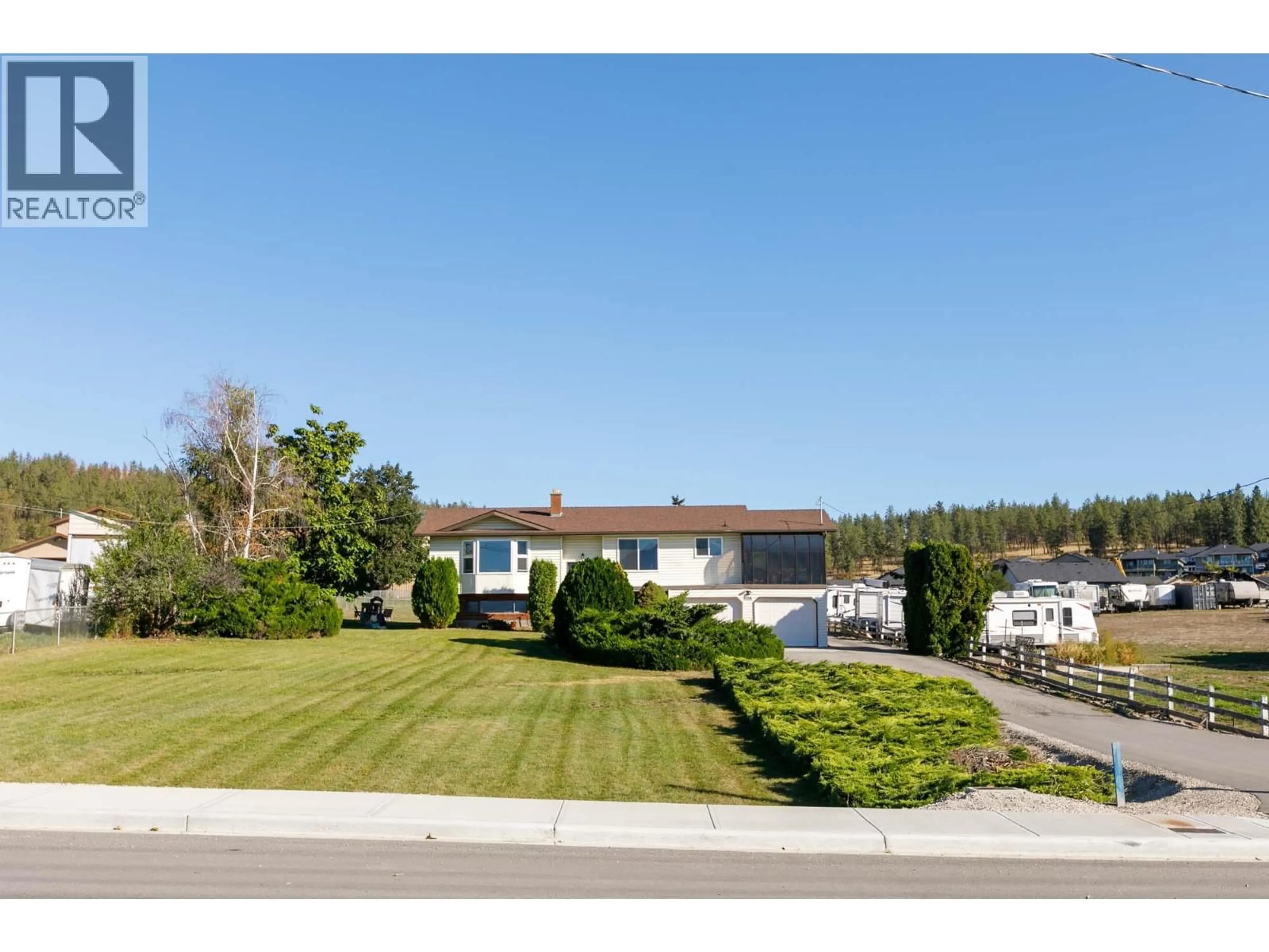 A pic from outside/outdoor area/front of a property/back of a property/a pic from drone, street for 3116 APPALOOSA ROAD, Kelowna British Columbia V1V2G9