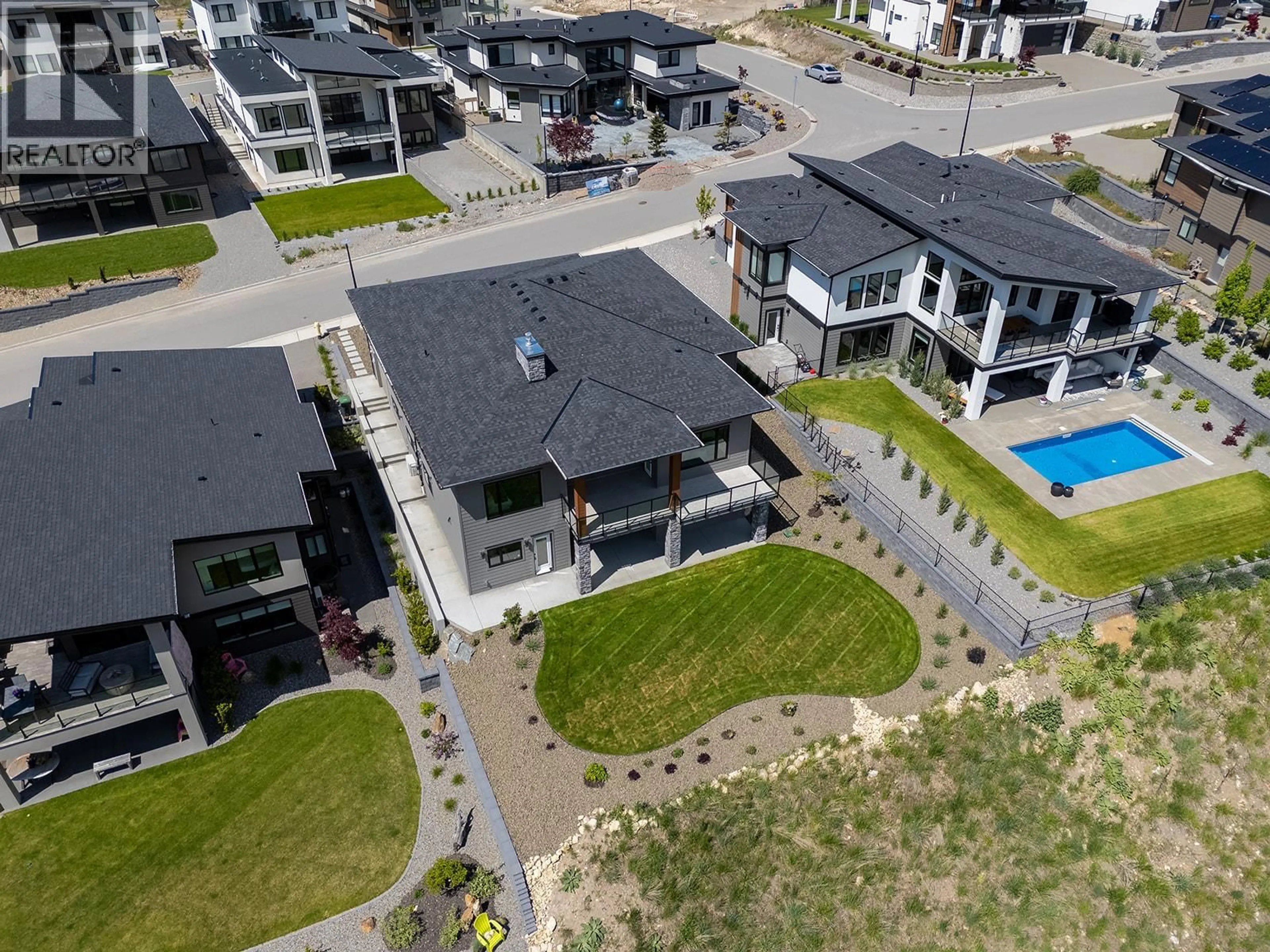 A pic from outside/outdoor area/front of a property/back of a property/a pic from drone, street for 771 CARNOUSTIE DRIVE, Kelowna British Columbia V1P0A3