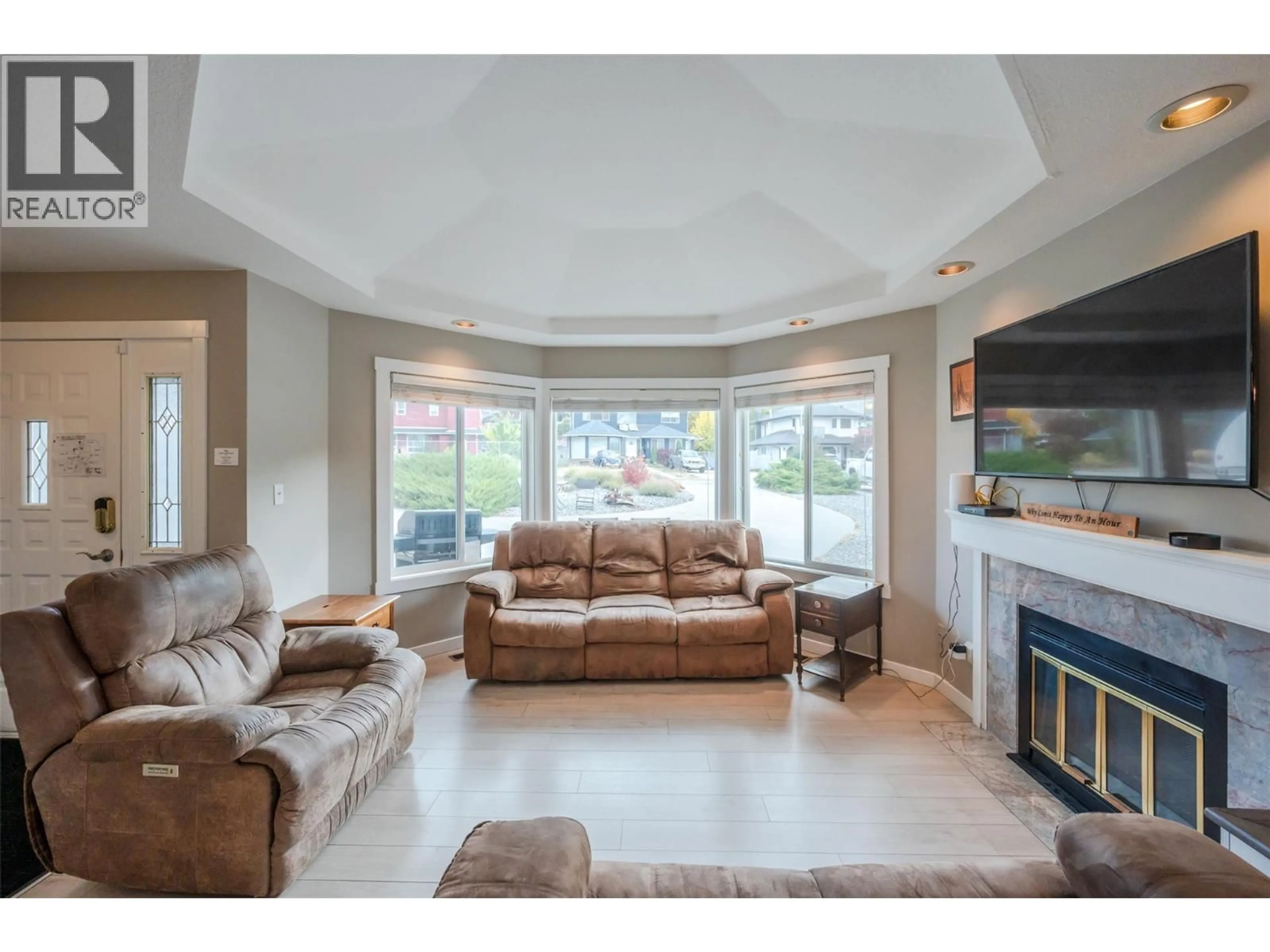 Living room with furniture, ceramic/tile floor for 138 EVERGREEN CRESCENT, Penticton British Columbia V2A7Y5